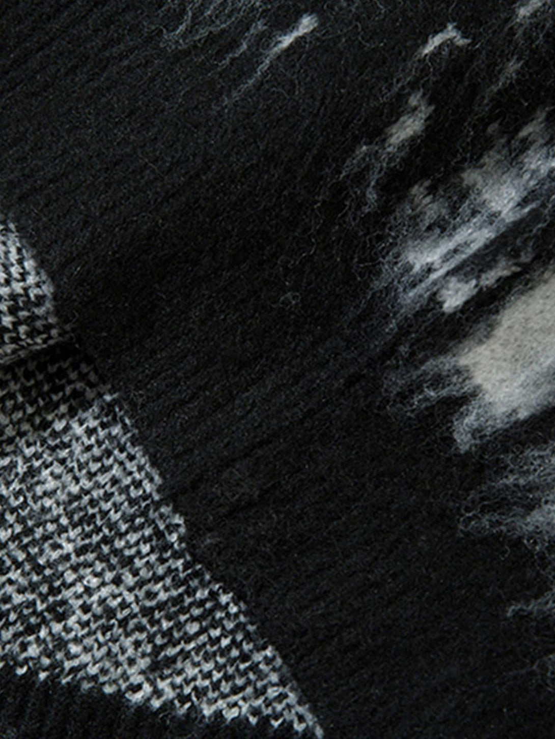Texture and pattern showcased in a mohair fuzzy sweater by TALISHKO, highlighting intricate details.