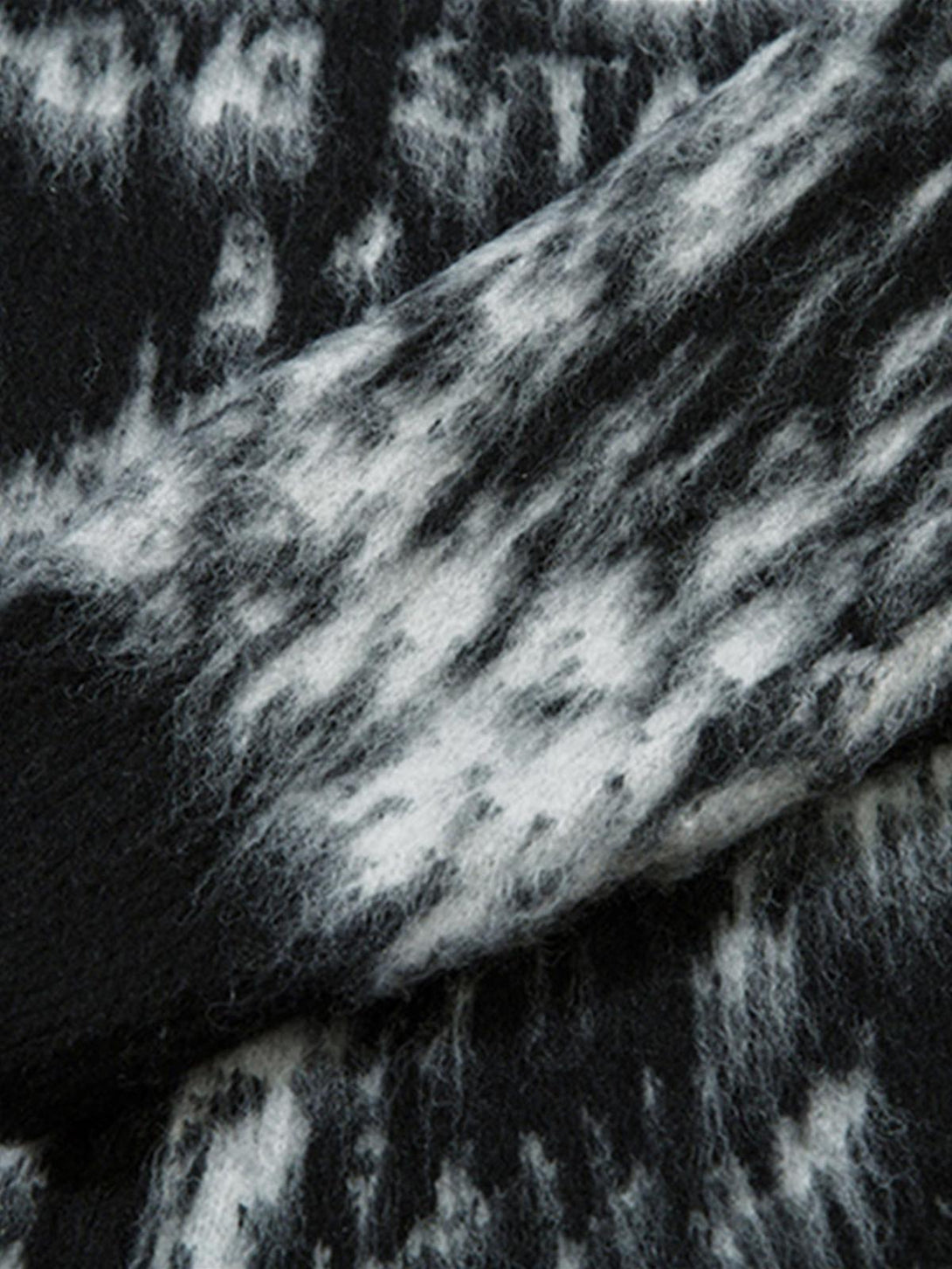 A detailed view of the mohair fuzzy fabric by TALISHKO, featuring a dynamic pattern.