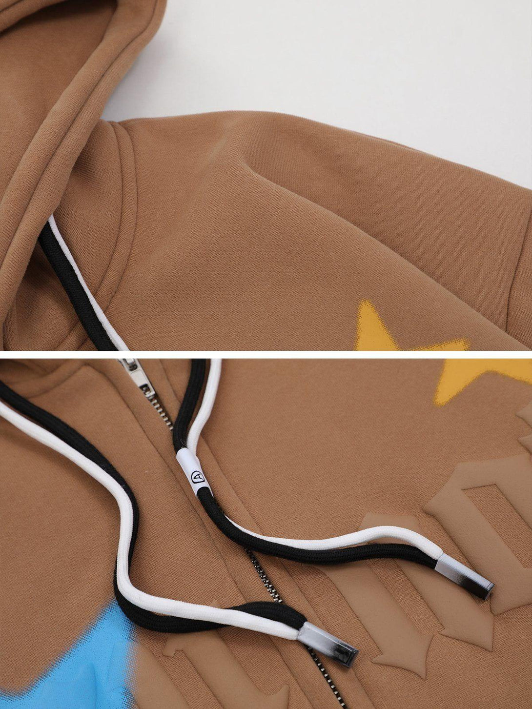 Intricate look at the TALISHKO zip hoodie, highlighting star prints and detailed drawstrings.