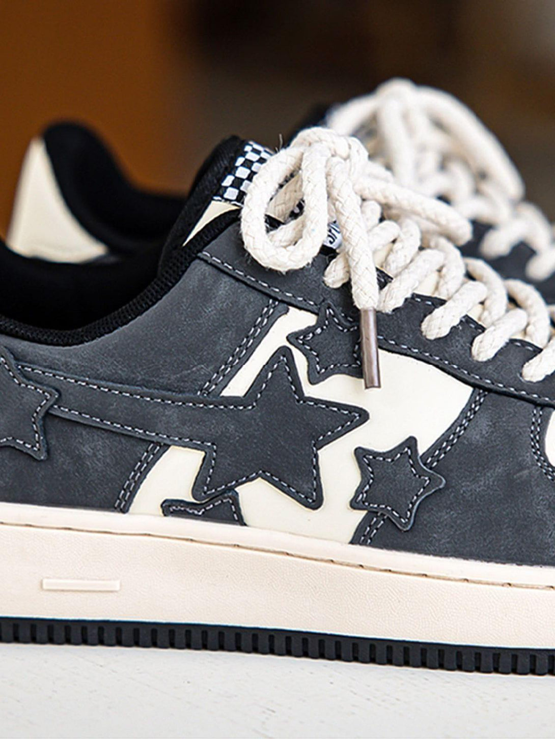 Intricate look at TALISHKO star skate shoes, highlighting star accents and woven laces.