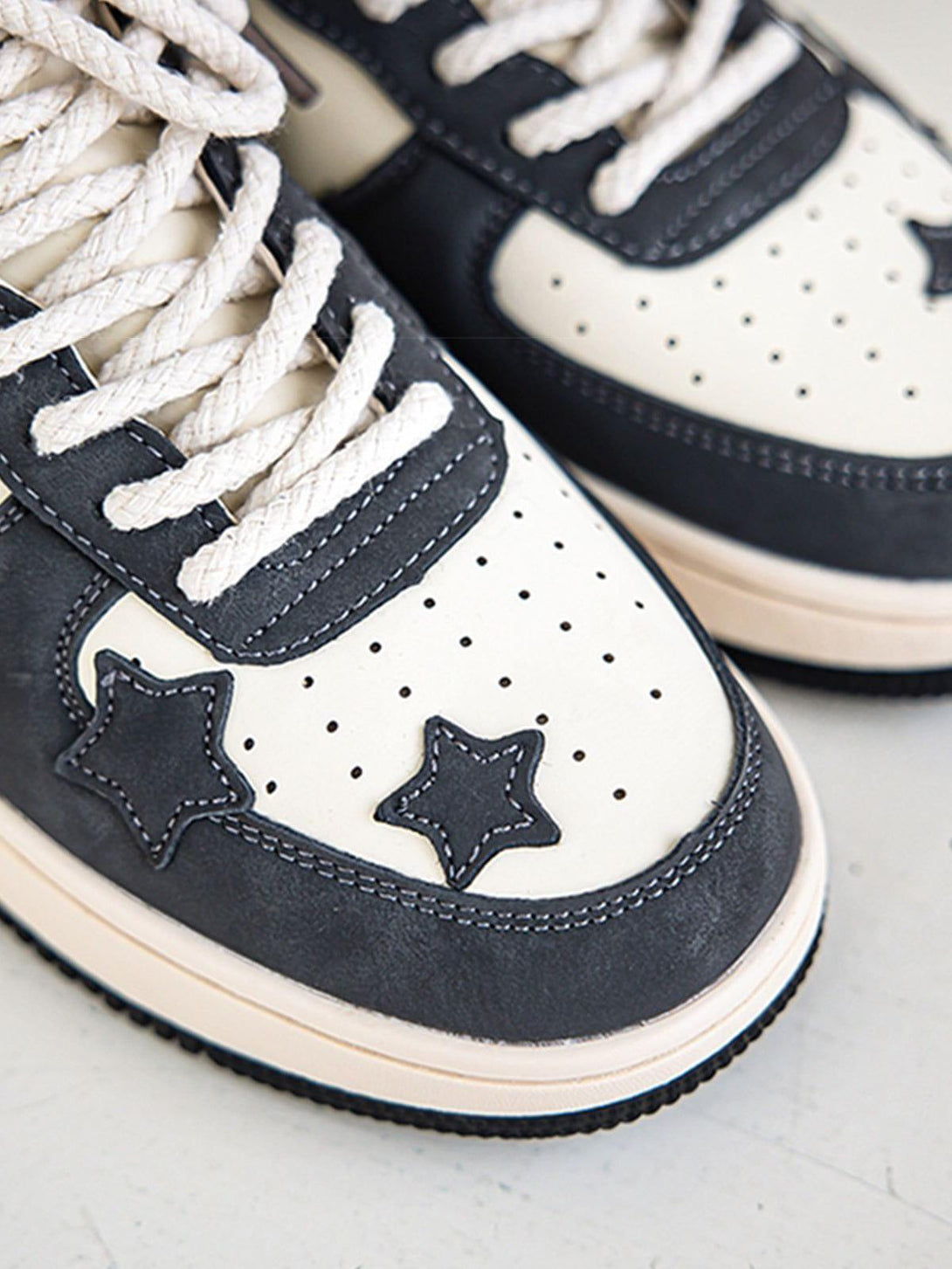 Close-up of TALISHKO star skate shoes, highlighting star accents and textured laces.