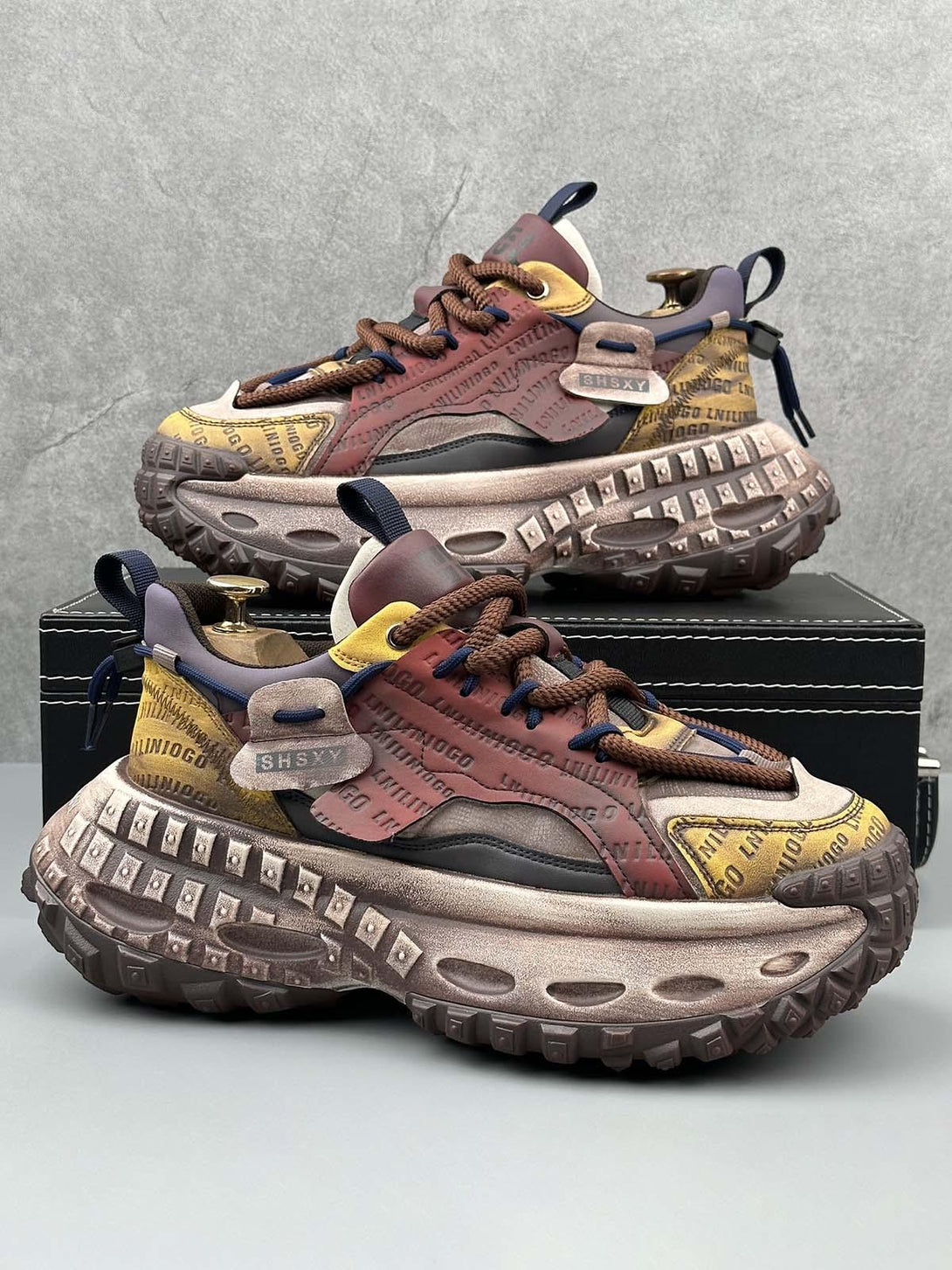 TALISHKO sneakers featuring a bold tire sole and vibrant lettering, showcasing unique stitching.