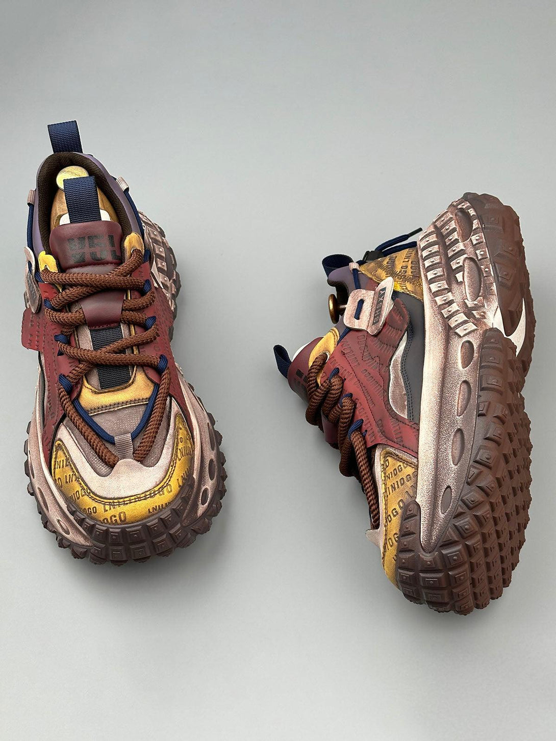 TALISHKO sneakers in a striking design with tire soles and bold letter details, offering style inspiration.