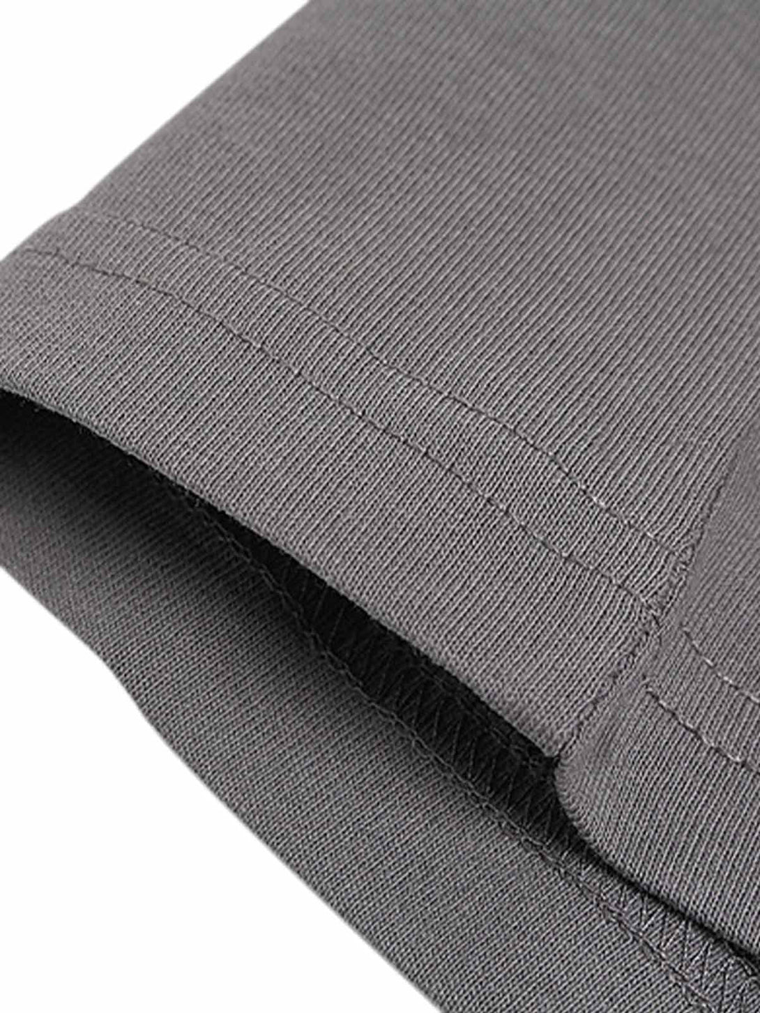 Intricate look at stitching detail on a gray graphic T-shirt by TALISHKO, emphasizing quality.