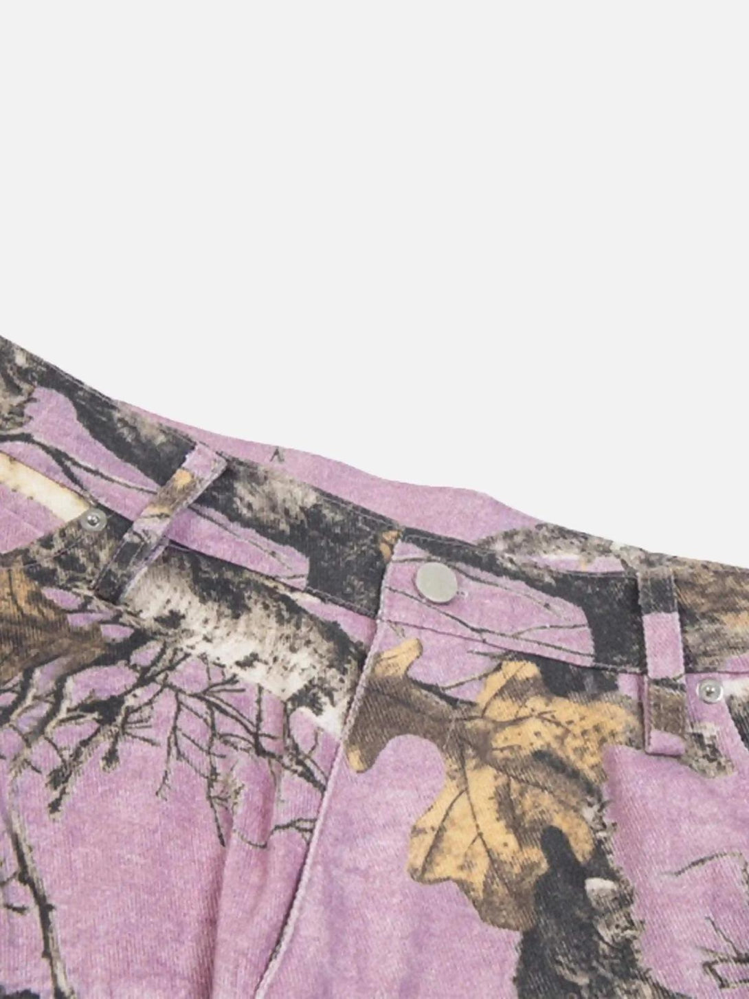 Intricate look at the branch pattern on TALISHKO's pink camouflage pants, showcasing unique details.