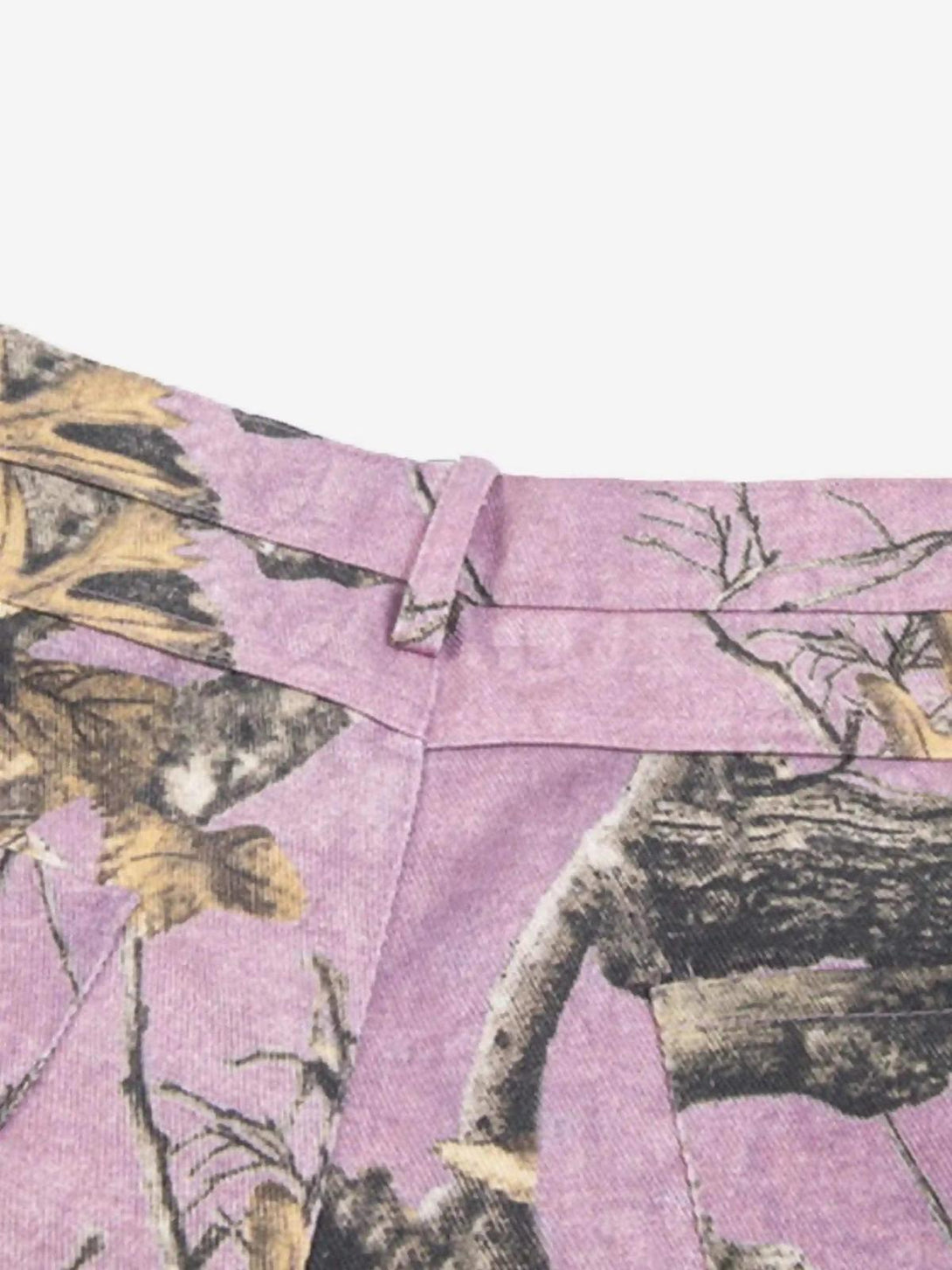 Zoomed-in texture of TALISHKO's street-inspired camouflage pants, showcasing unique details.