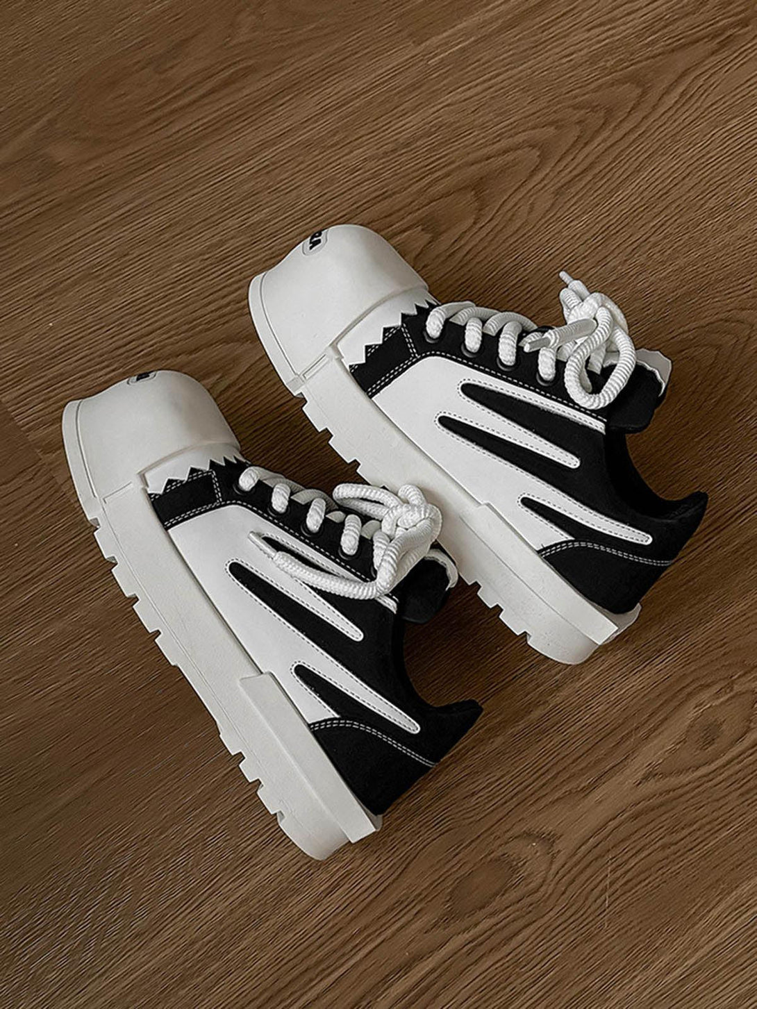 TALISHKO sneakers showcasing bold contrast and chunky sole, perfect for street style.