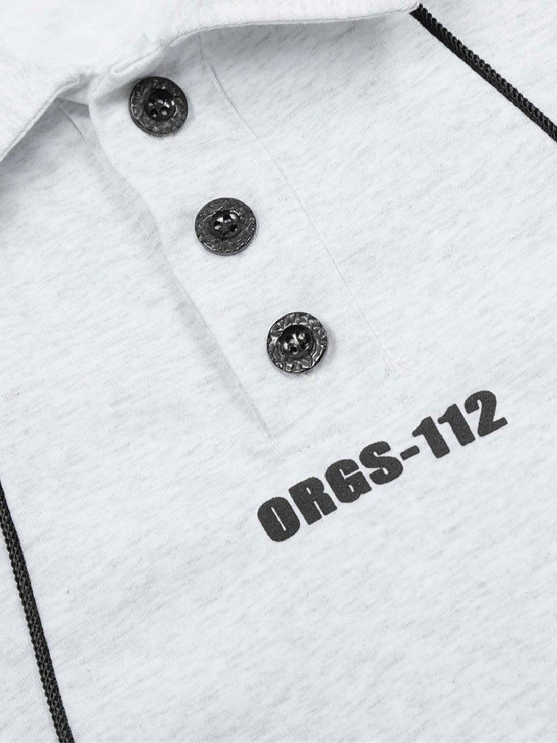 A close-up of a light gray polo shirt by TALISHKO, featuring contrast buttons and "ORGS-112" text.