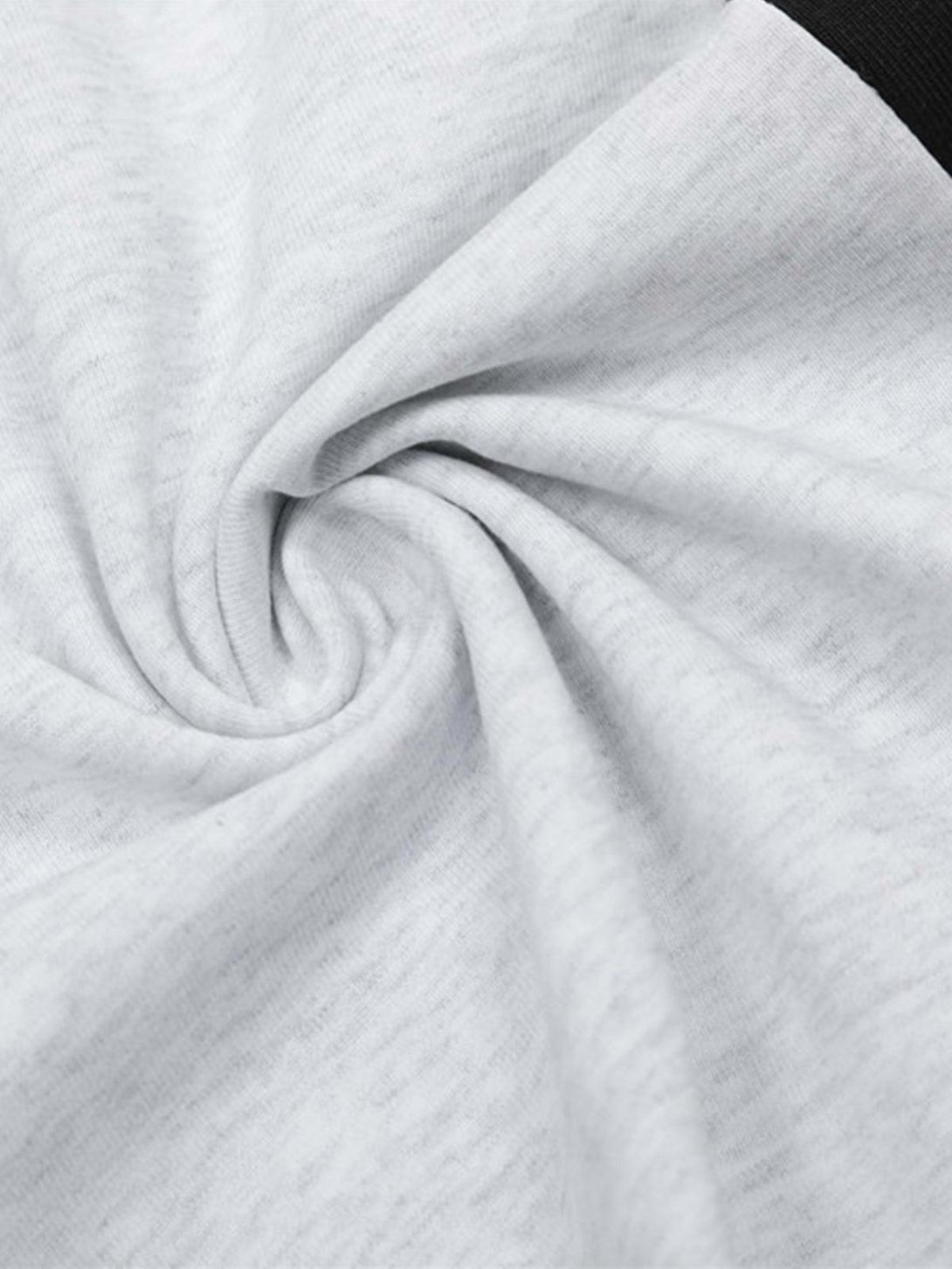 Intricate look at the soft texture of the street contrast panel polo shirt by TALISHKO.