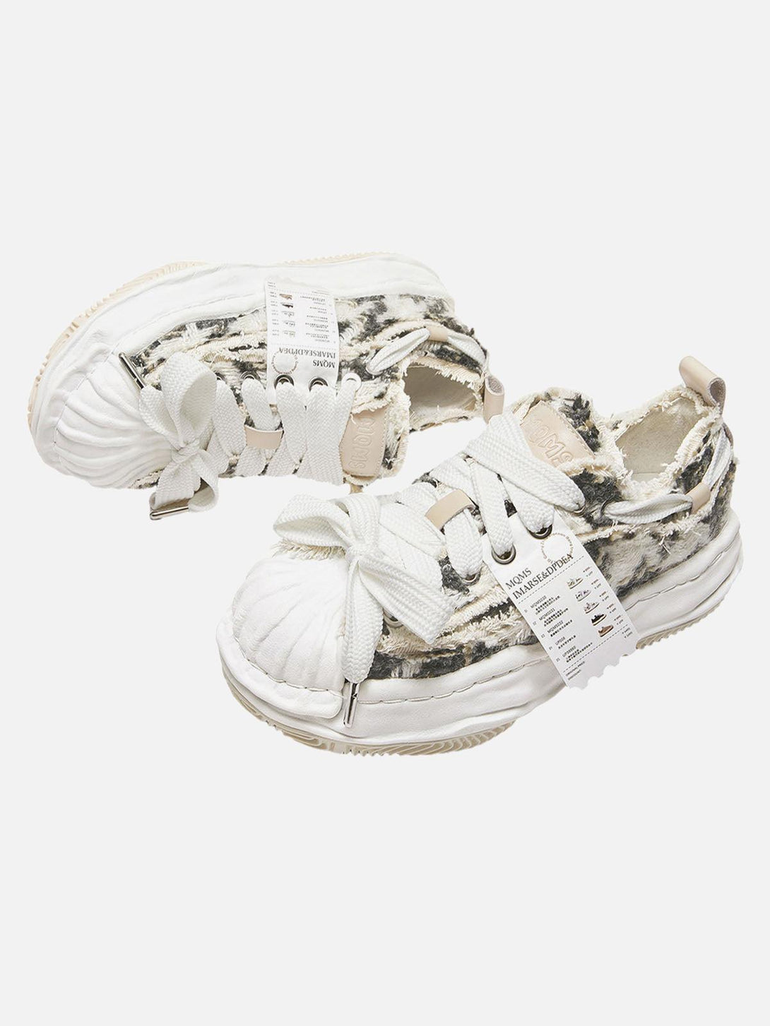 Focusing on the TALISHKO sneakers' deconstructed style with bold textures and unique design.