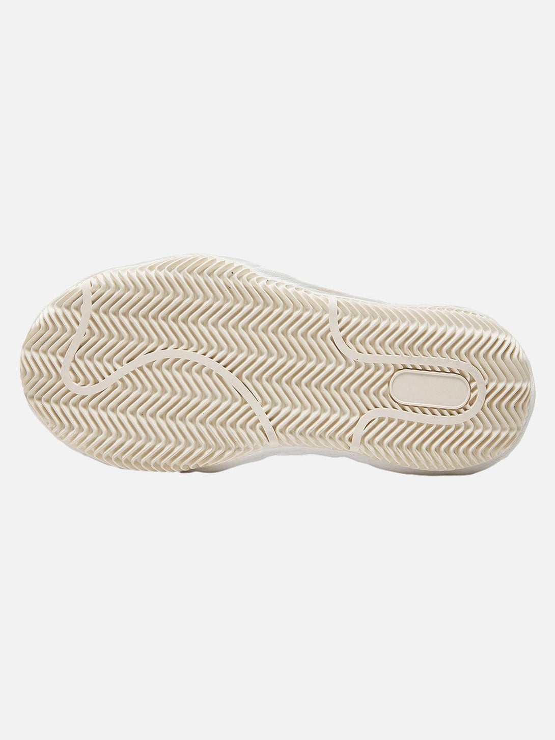 A detailed view of the TALISHKO sneaker sole, highlighting its intricate textured pattern.