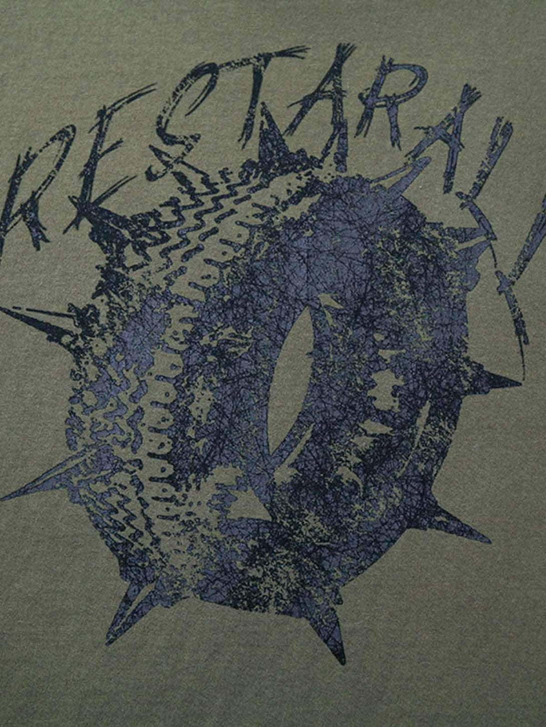 Detailed view of TALISHKO T-shirt, showcasing edgy street-inspired tire graffiti design.