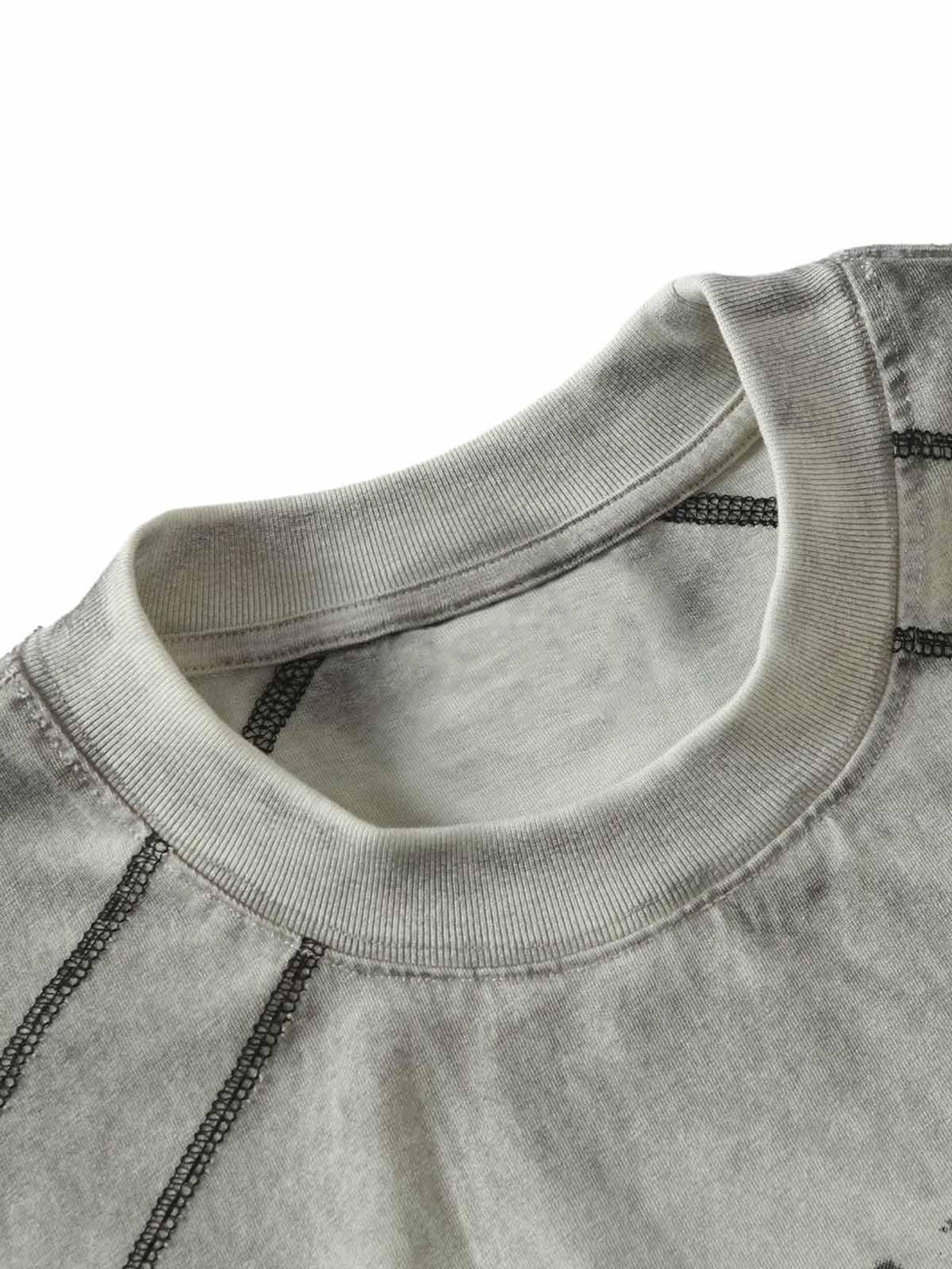 Detailed fabric and stitching of a TALISHKO motorcycle T-shirt with a vintage-inspired gradient.