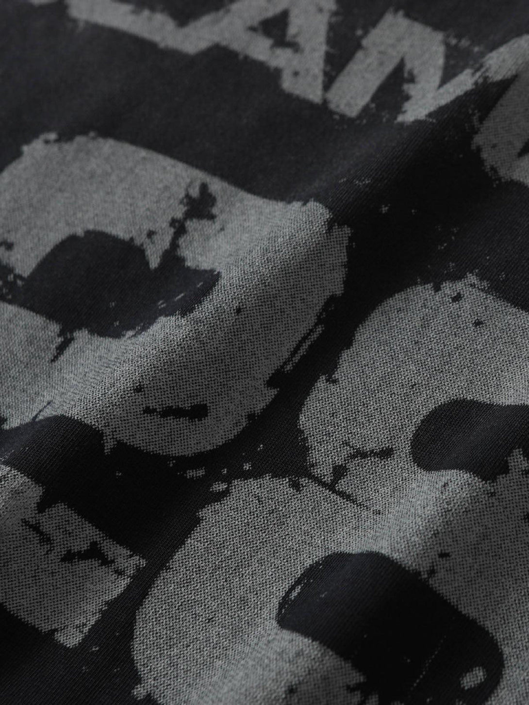 Detailed view of TALISHKO motorcycle T-shirt with distressed lettering and grunge texture.