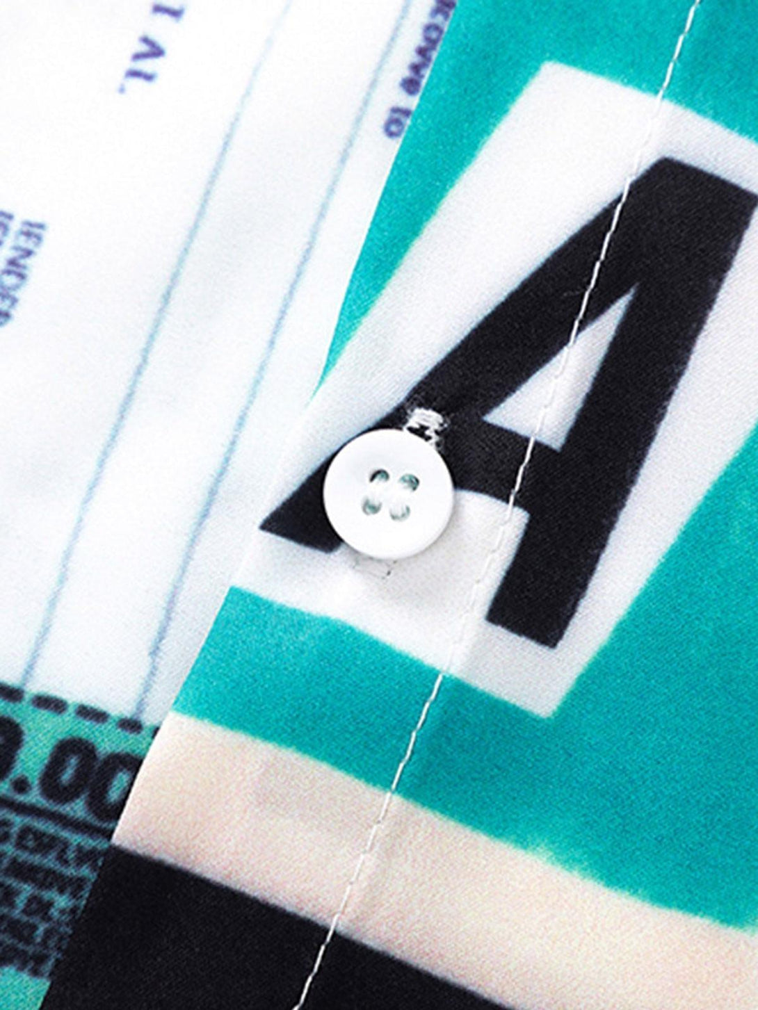 Focusing on TALISHKO shirt button detail, highlighting vibrant colors and bold print design.