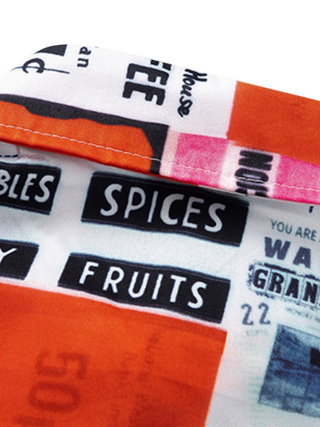 A close-up of TALISHKO shirt fabric, showcasing vibrant prints and detailed stitching.
