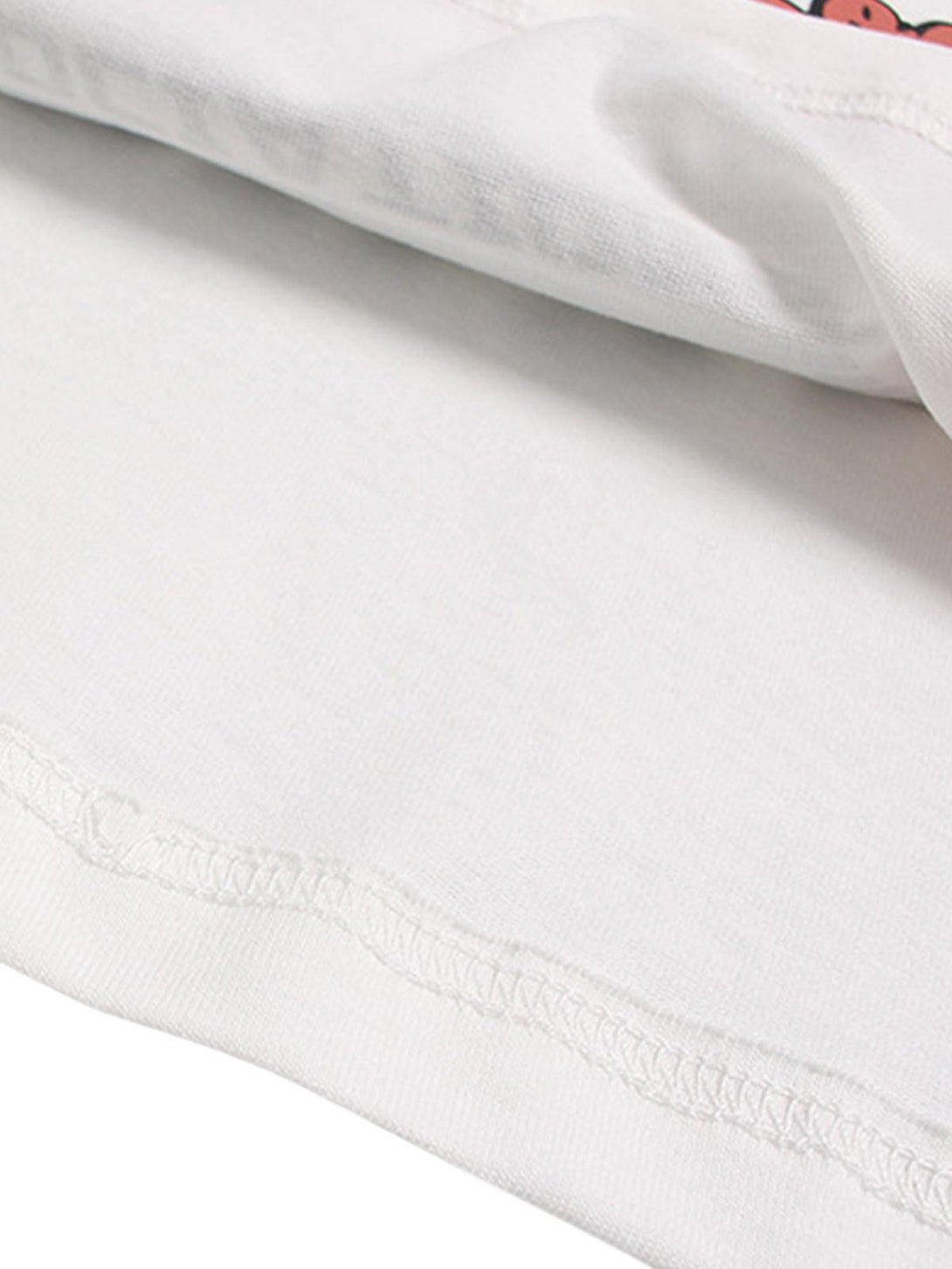 Detailed fabric and stitching of a TALISHKO street graphic print T-shirt, highlighting quality craftsmanship.