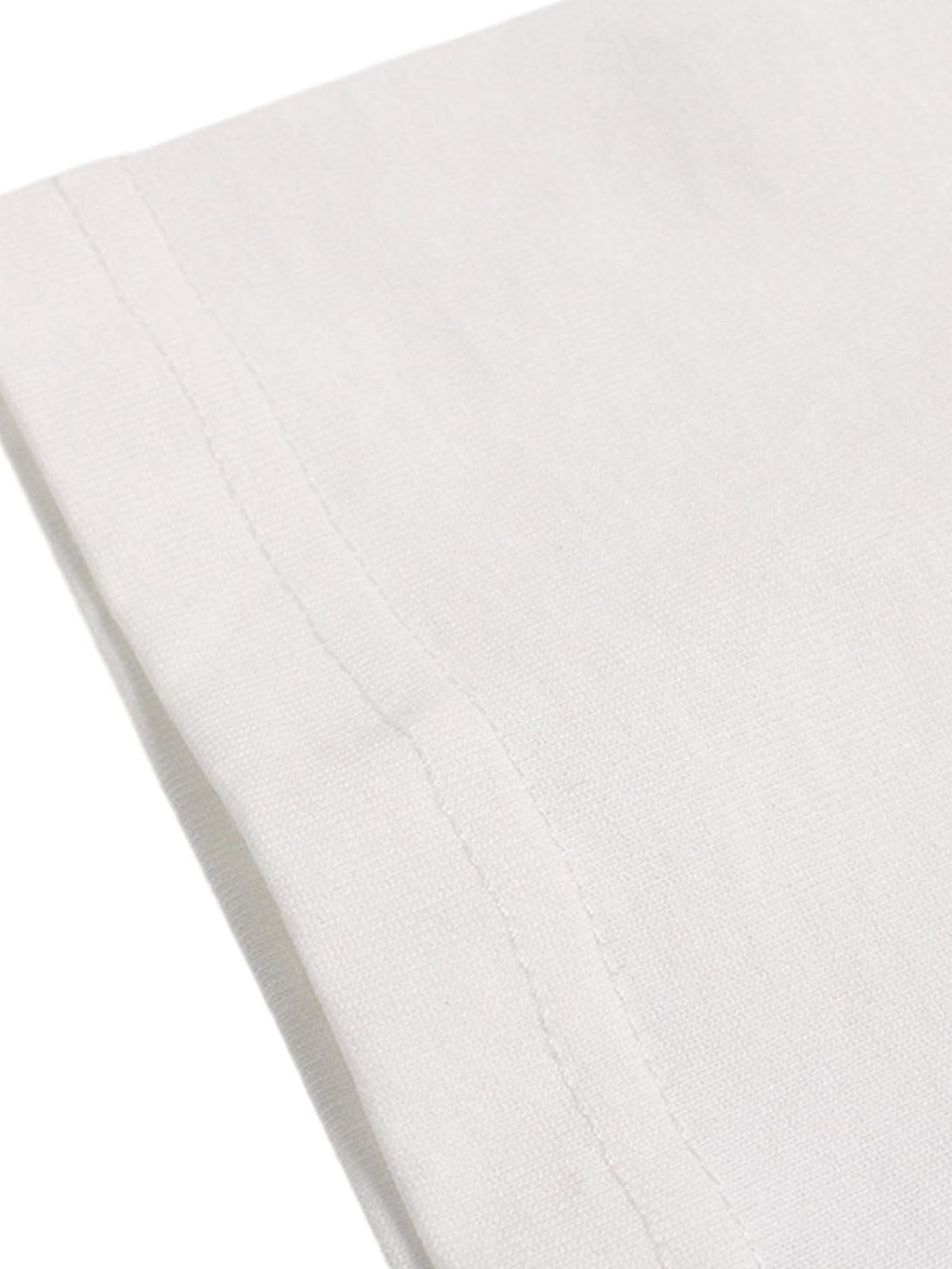 Zoomed-in texture of a TALISHKO street graphic print T-shirt, highlighting fine stitching details.