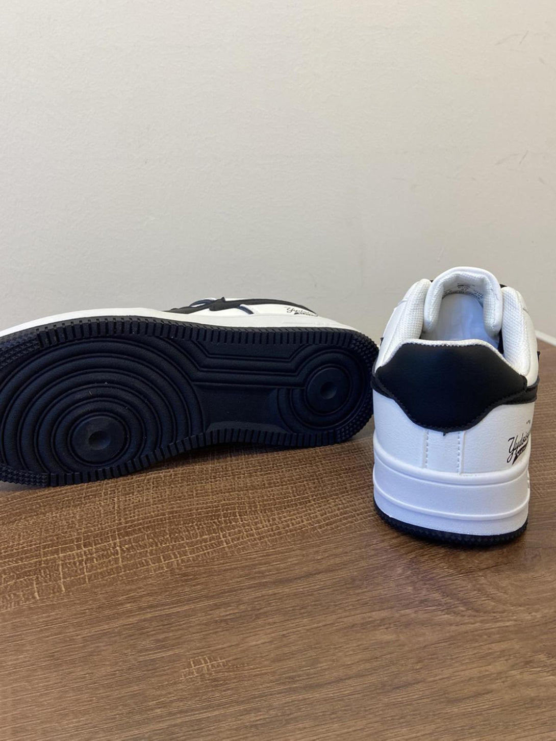 TALISHKO skate shoes showcasing a black sole and white back detail, perfect for streetwear style.