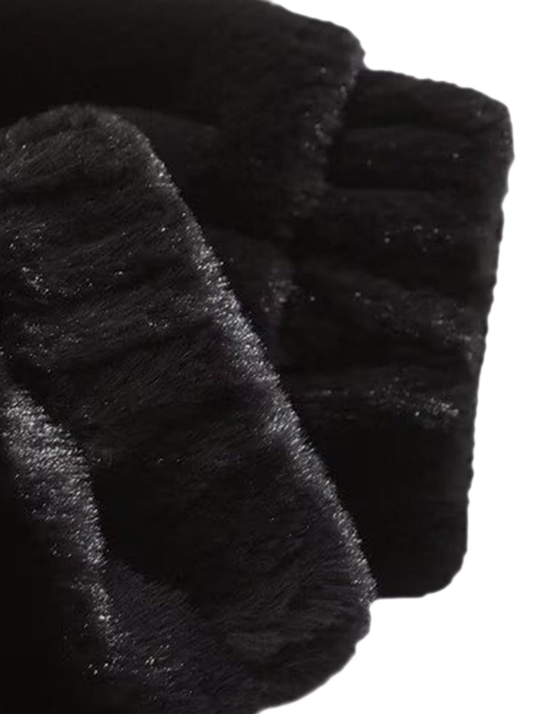 A close-up of TALISHKO's fleece jacket, highlighting its luxurious black texture.