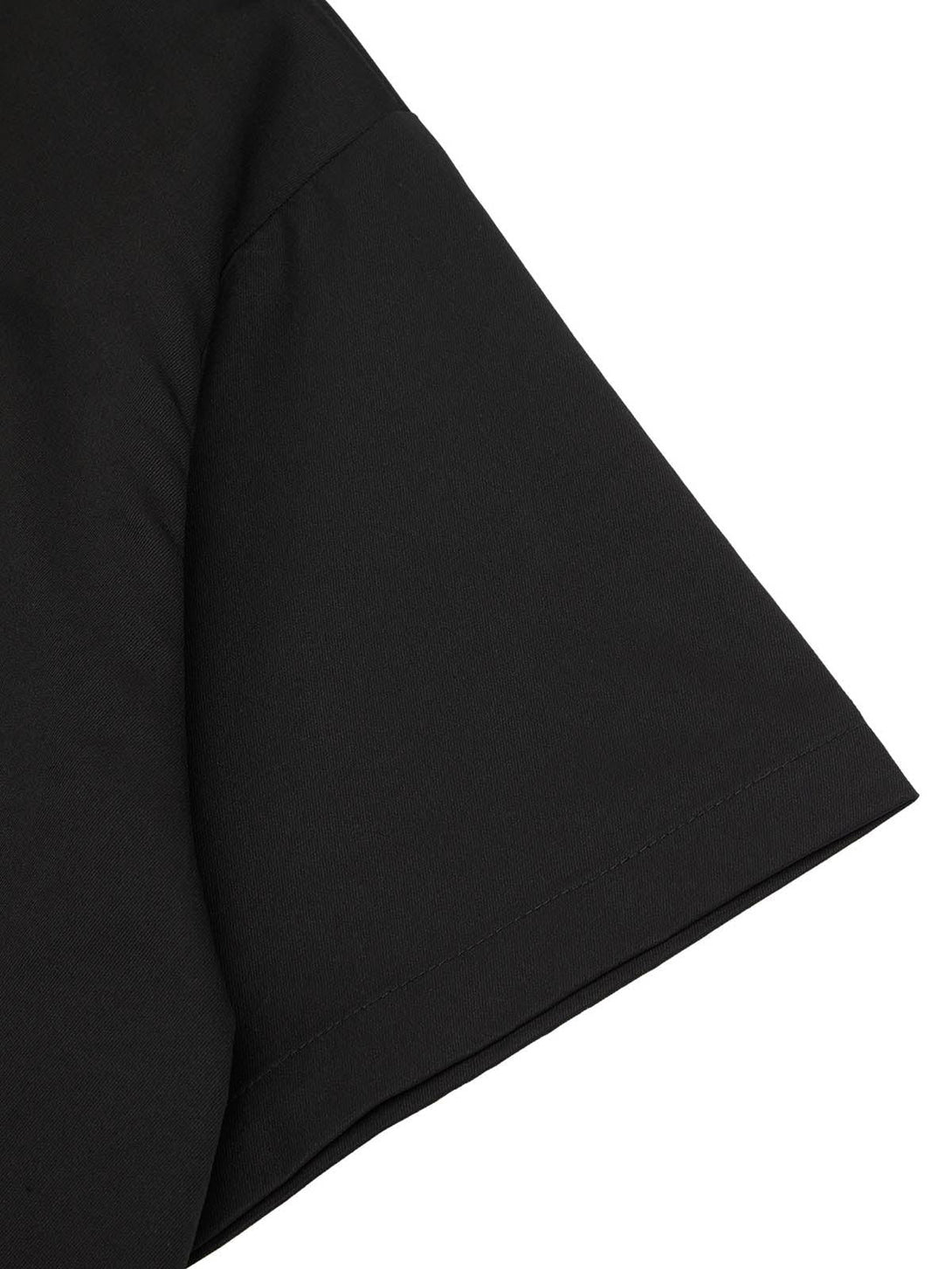 Detailed fabric and stitching of TALISHKO's black short sleeve shirt.