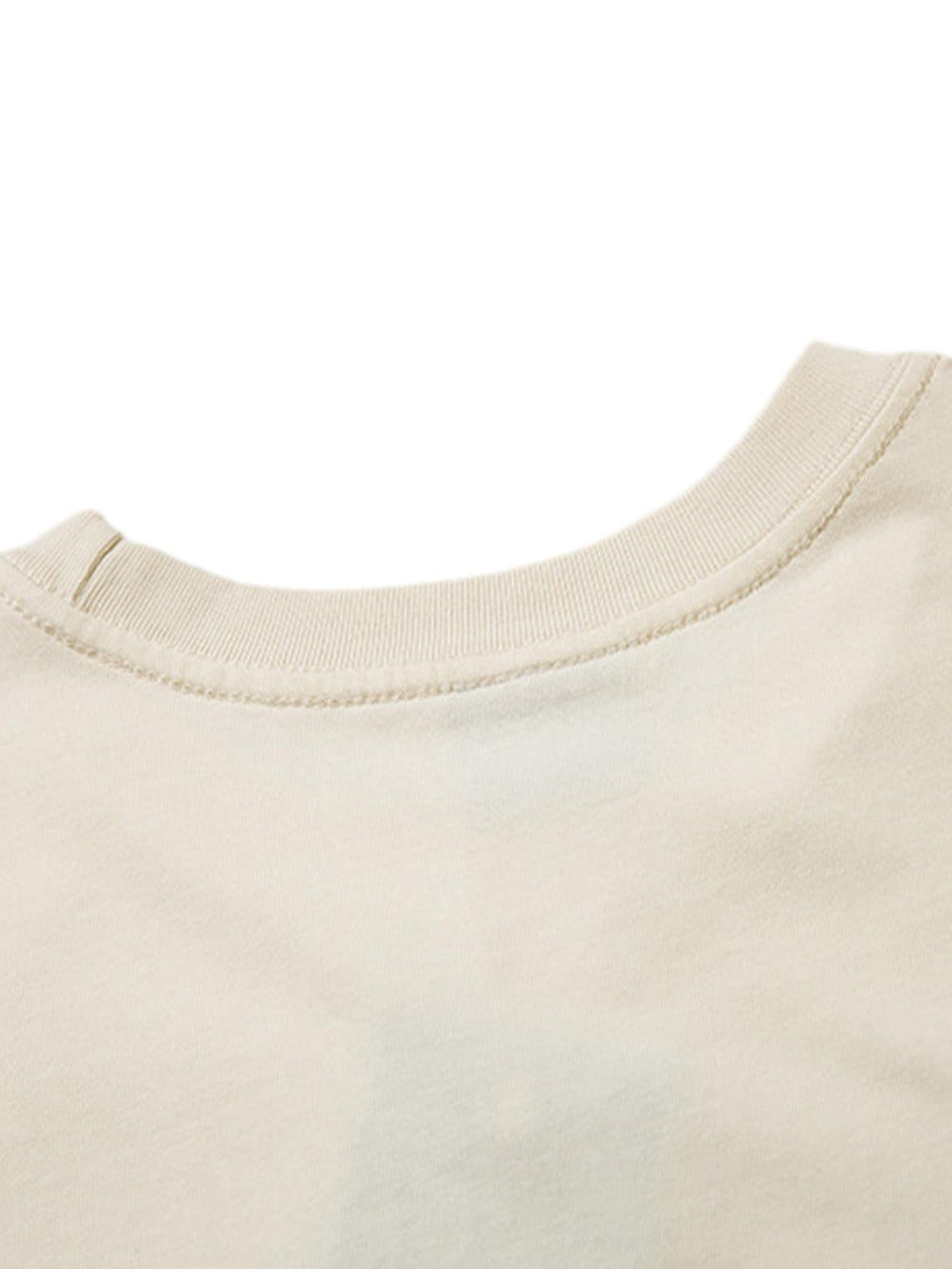 Neckline detail of TALISHKO vest, highlighting soft fabric and subtle stitching style.