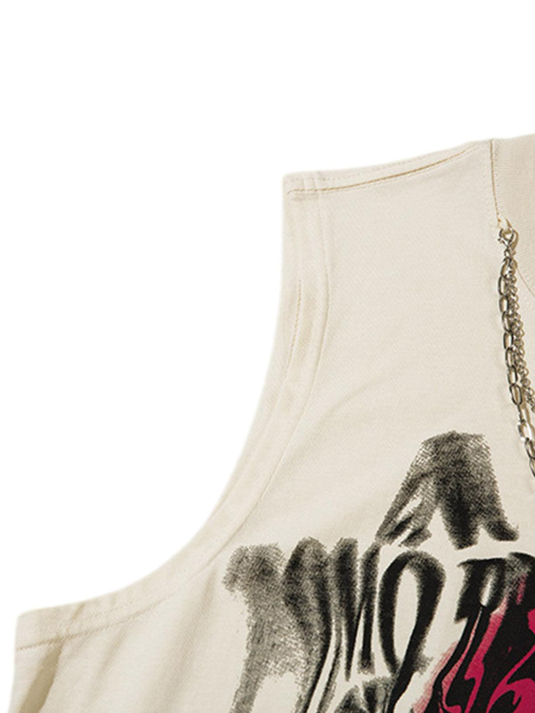 A close-up of TALISHKO's graffiti spray-painted vest, featuring chain detail and bold design.