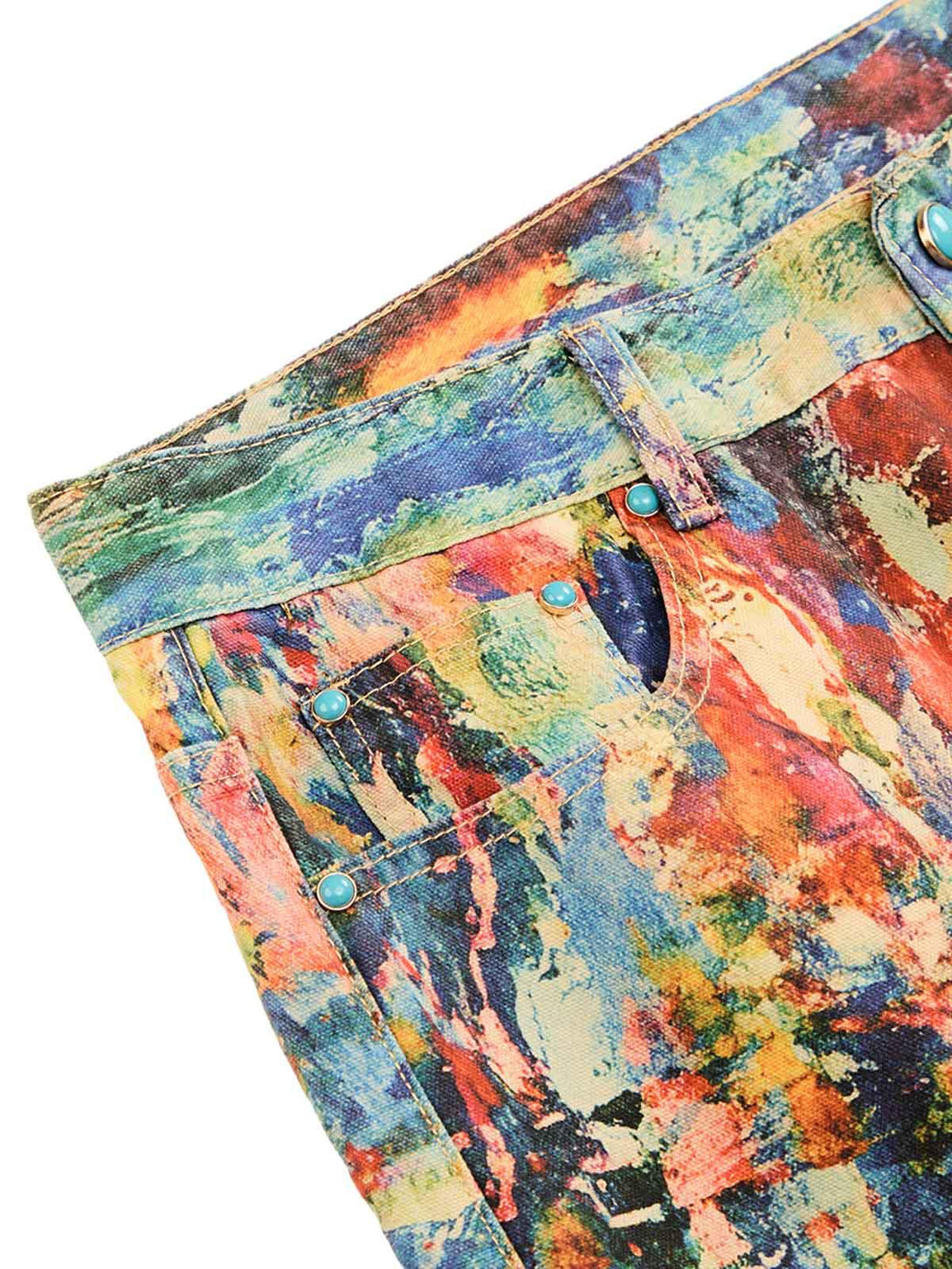 Intricate look at TALISHKO's vibrant jeans showcasing an artistic oil painting pattern.