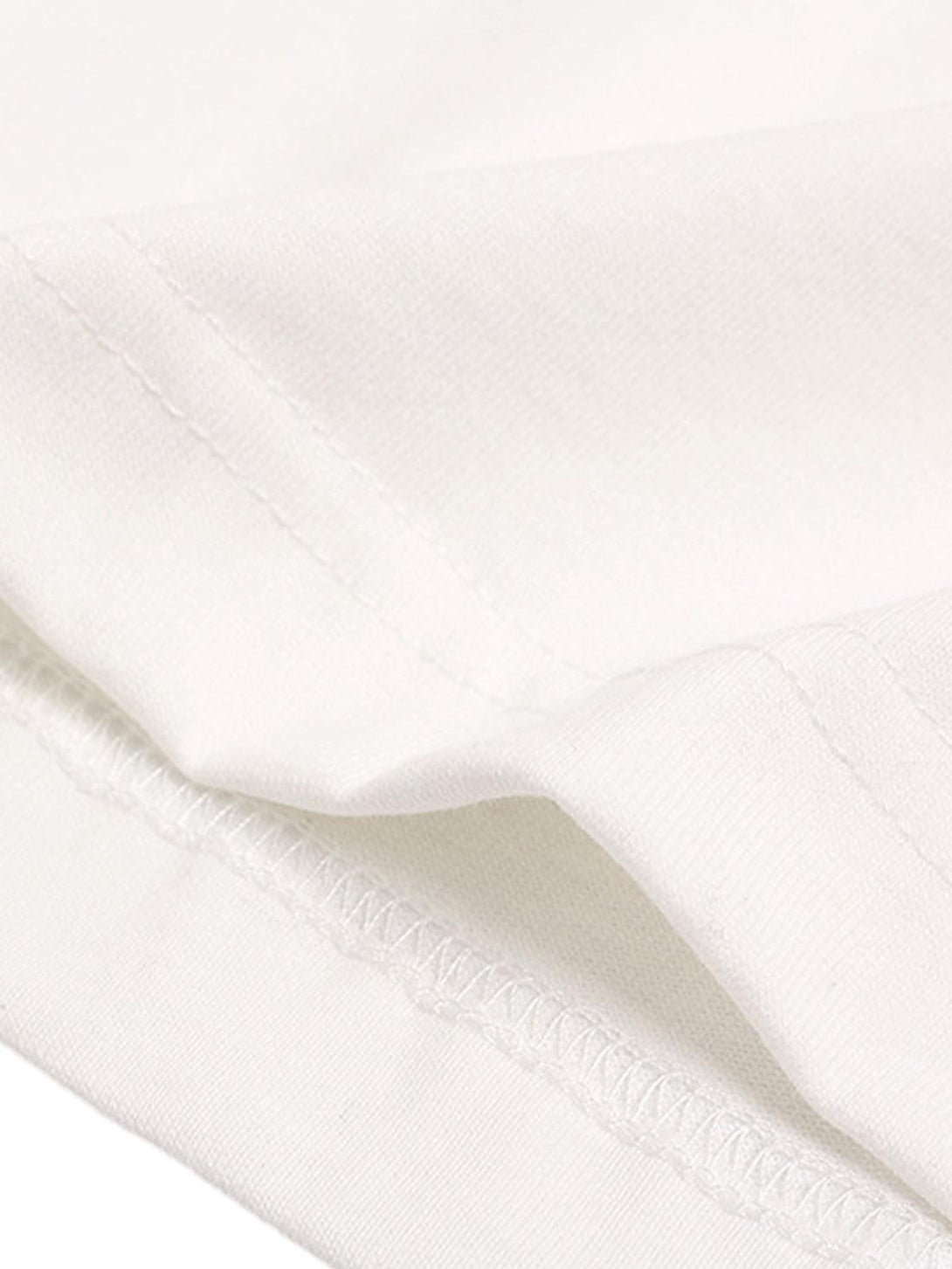 Detailed fabric and stitching on TALISHKO T-shirt, showcasing craftsmanship and quality.