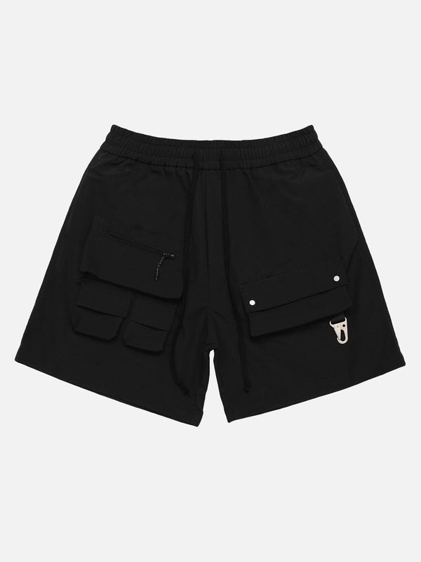TALISHKO's black streetwear shorts feature a unique patchwork design with multiple pockets.