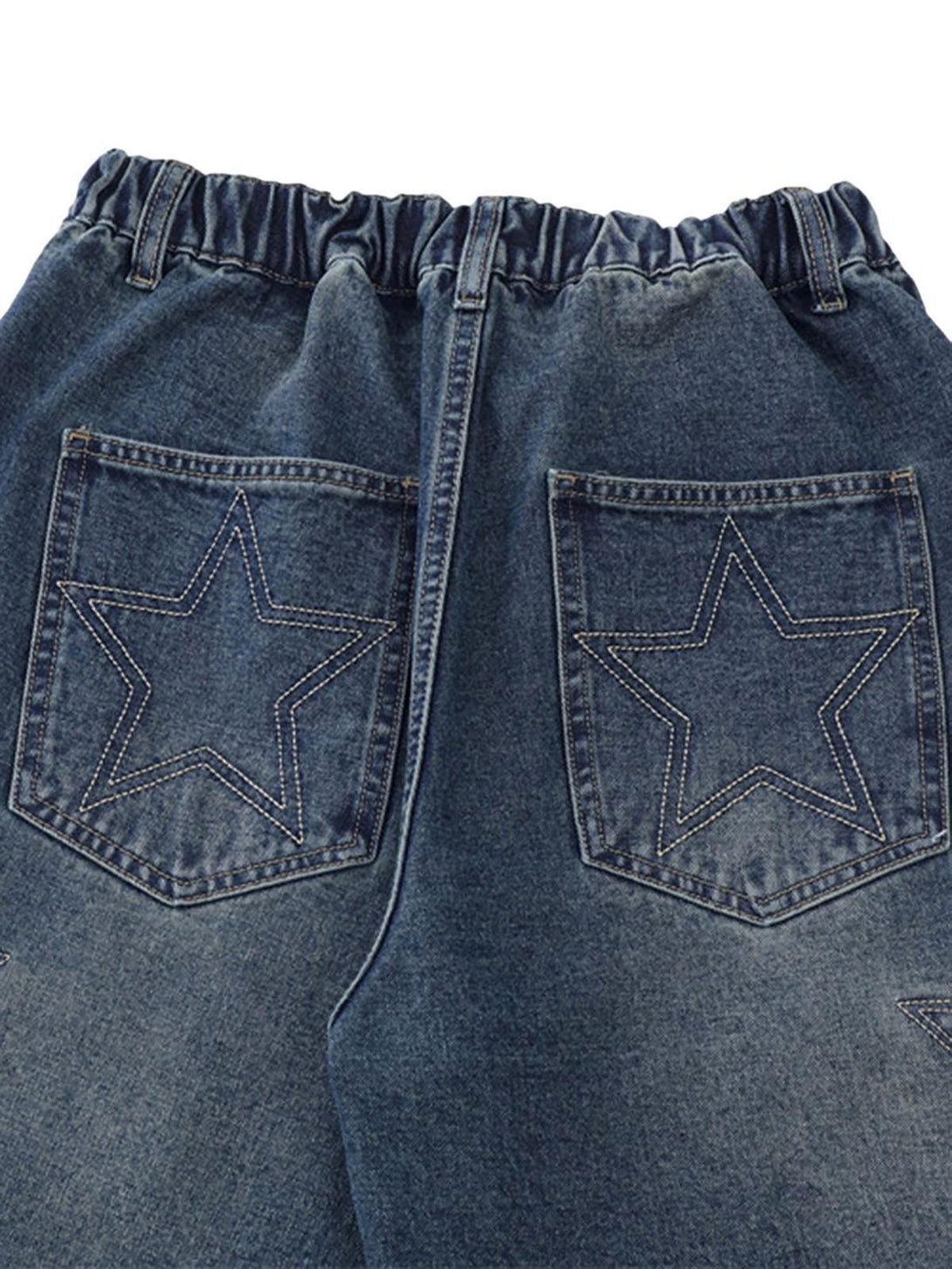 Back view of TALISHKO denim shorts with star embroidery and elastic waistband detail.
