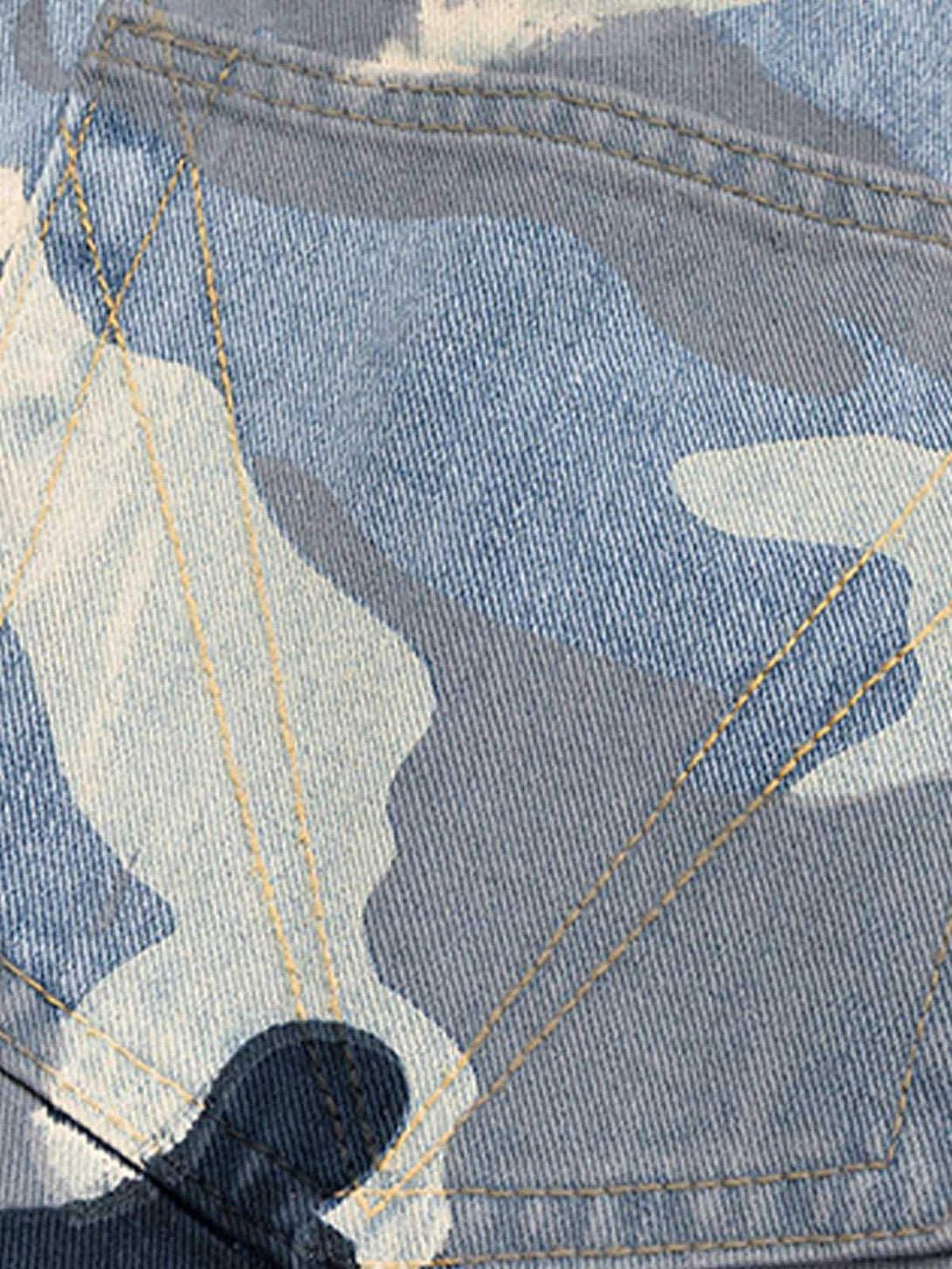 Detailed view of TALISHKO's blue camouflage fabric, highlighting unique stitching patterns.