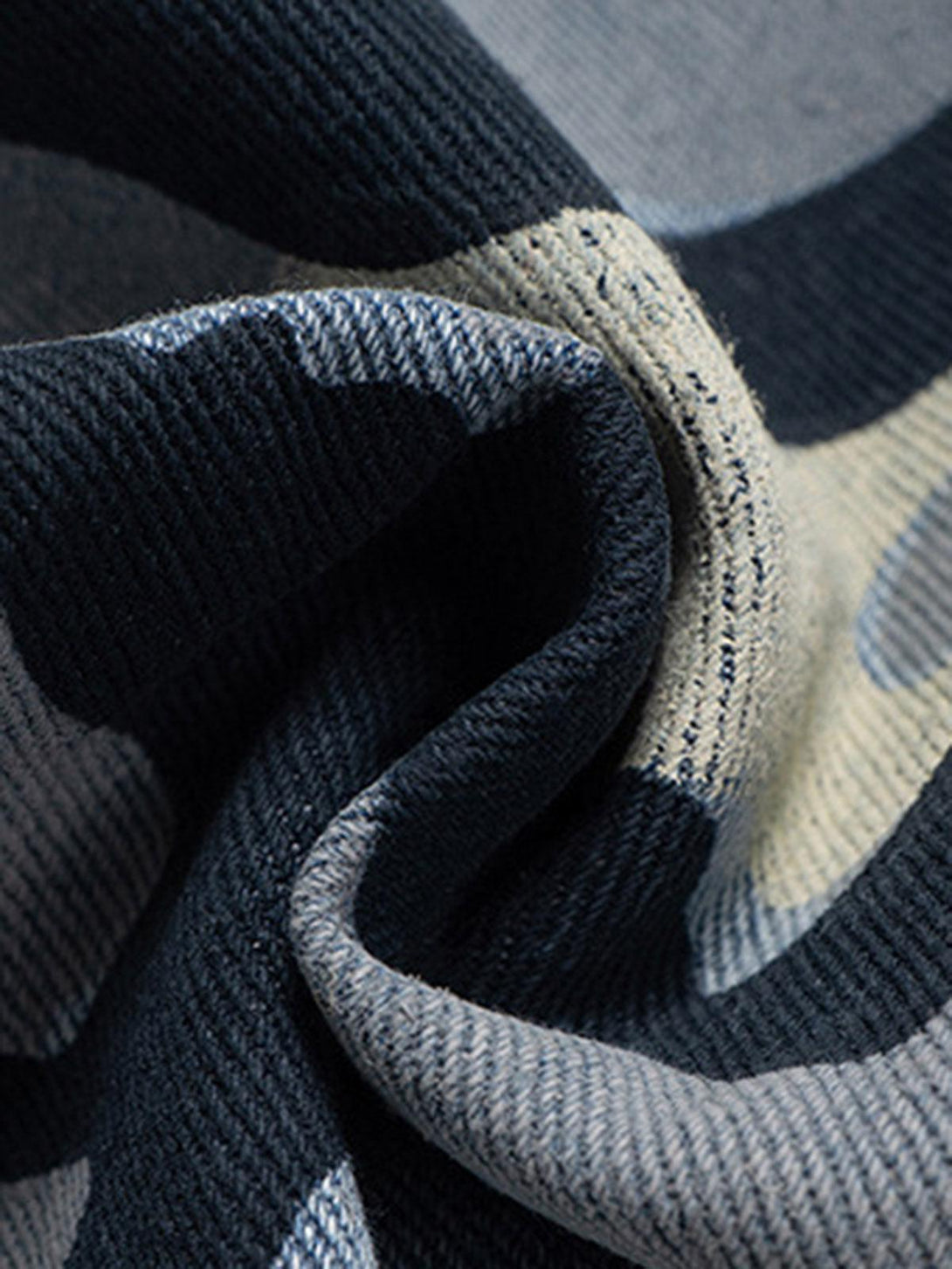 Zoomed-in texture of TALISHKO camouflage fabric, highlighting intricate design details.