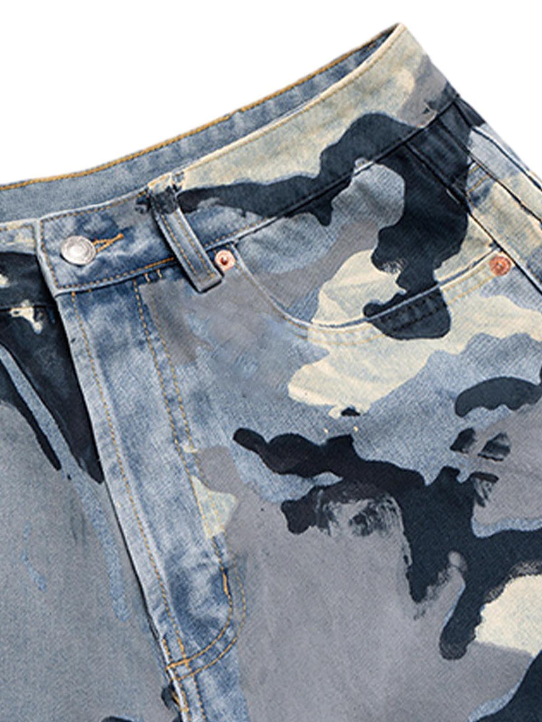 Intricate look at the camouflage pattern on TALISHKO's baggy jeans, emphasizing urban flair.