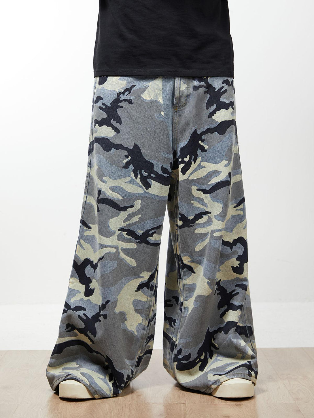 Baggy camouflage jeans by TALISHKO, showcasing a relaxed fit and bold streetwear vibe.