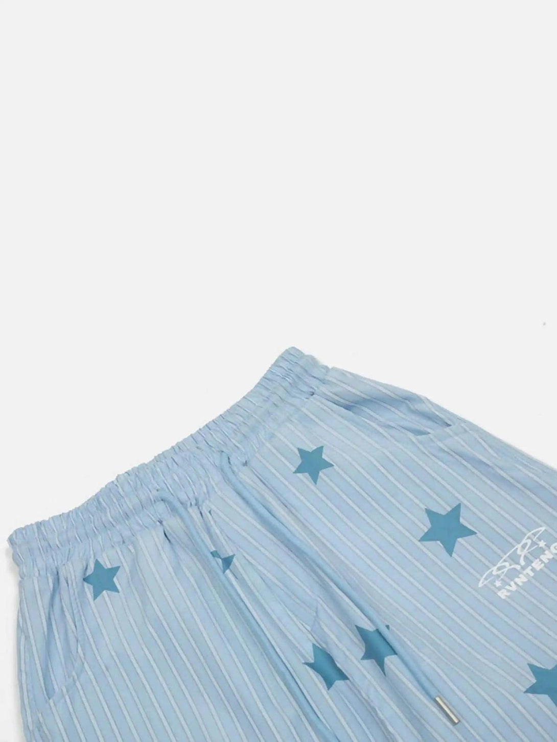 TALISHKO trousers showcasing blue star and stripe design, highlighting retro style details.