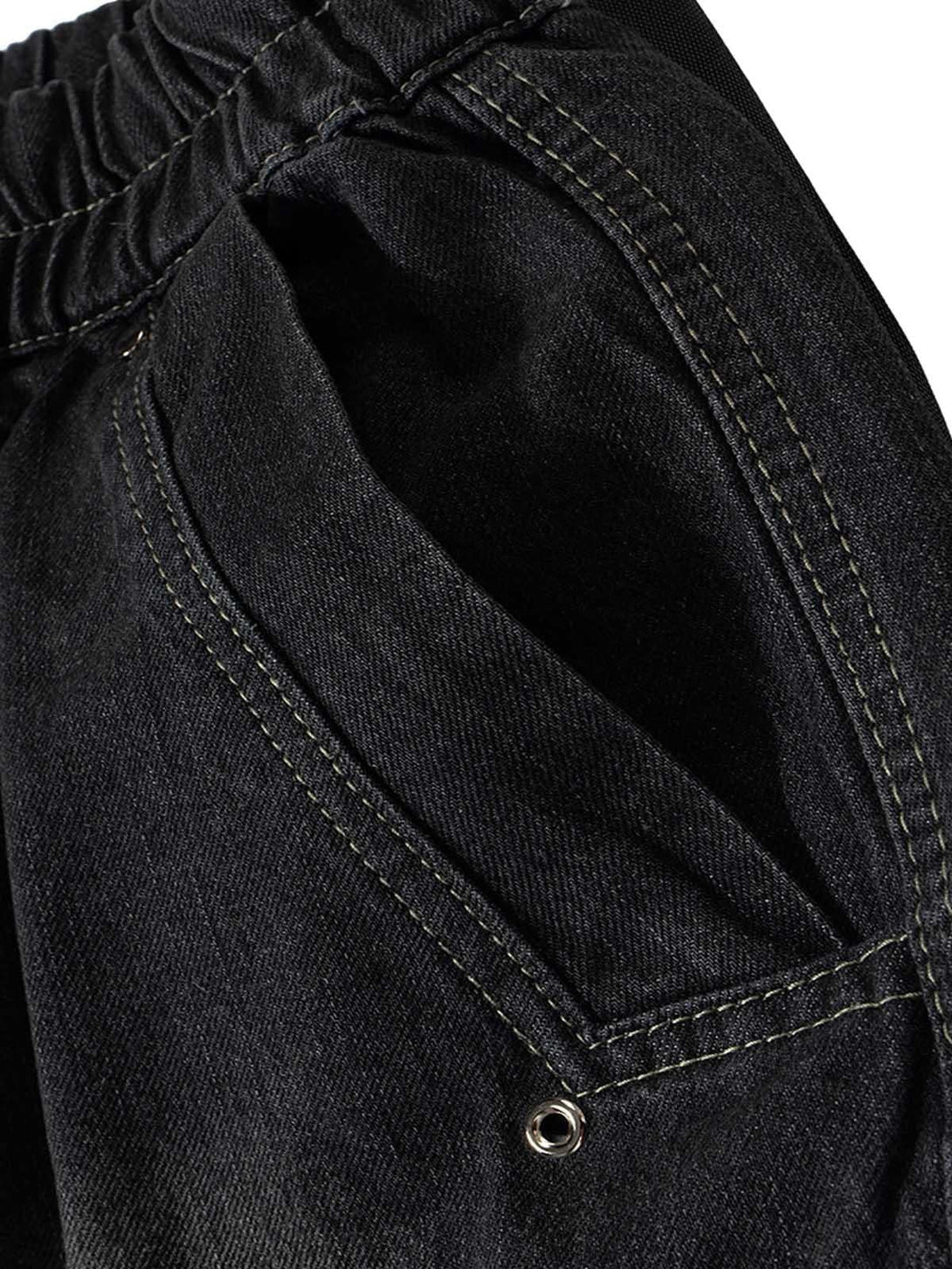 Intricate look at TALISHKO's washed denim cargo jort, highlighting the pocket and stitching details.