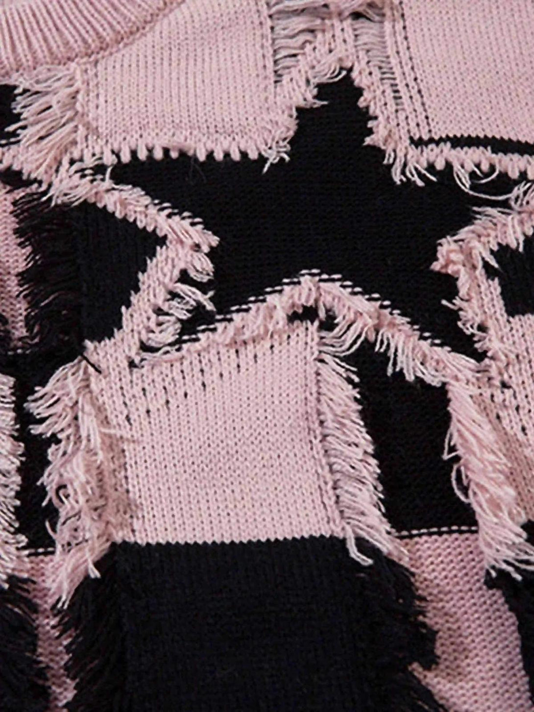 The TALISHKO sweater's distressed star and stripe pattern in pink and black, showcasing texture.