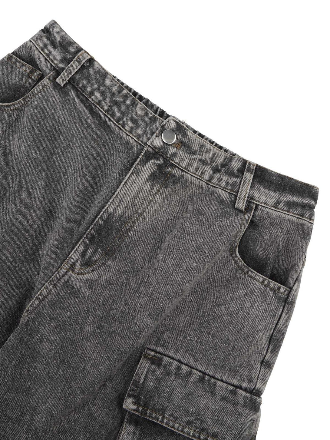 A detailed view of TALISHKO's dark gray workwear jeans showcasing multi-pocket design and texture.