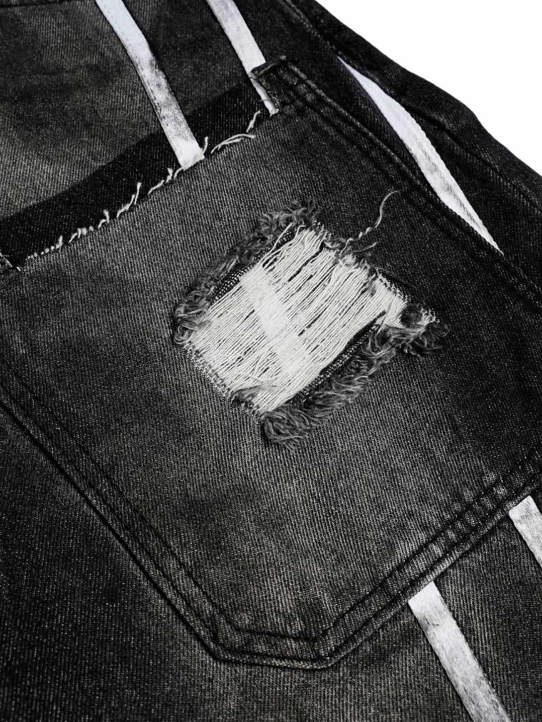 Frayed patch detail on black barrel jeans with stripe accents by TALISHKO.