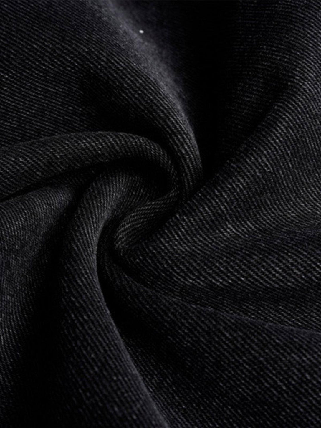 Texture and pattern showcased in TALISHKO black paneled work jeans fabric, highlighting durability.