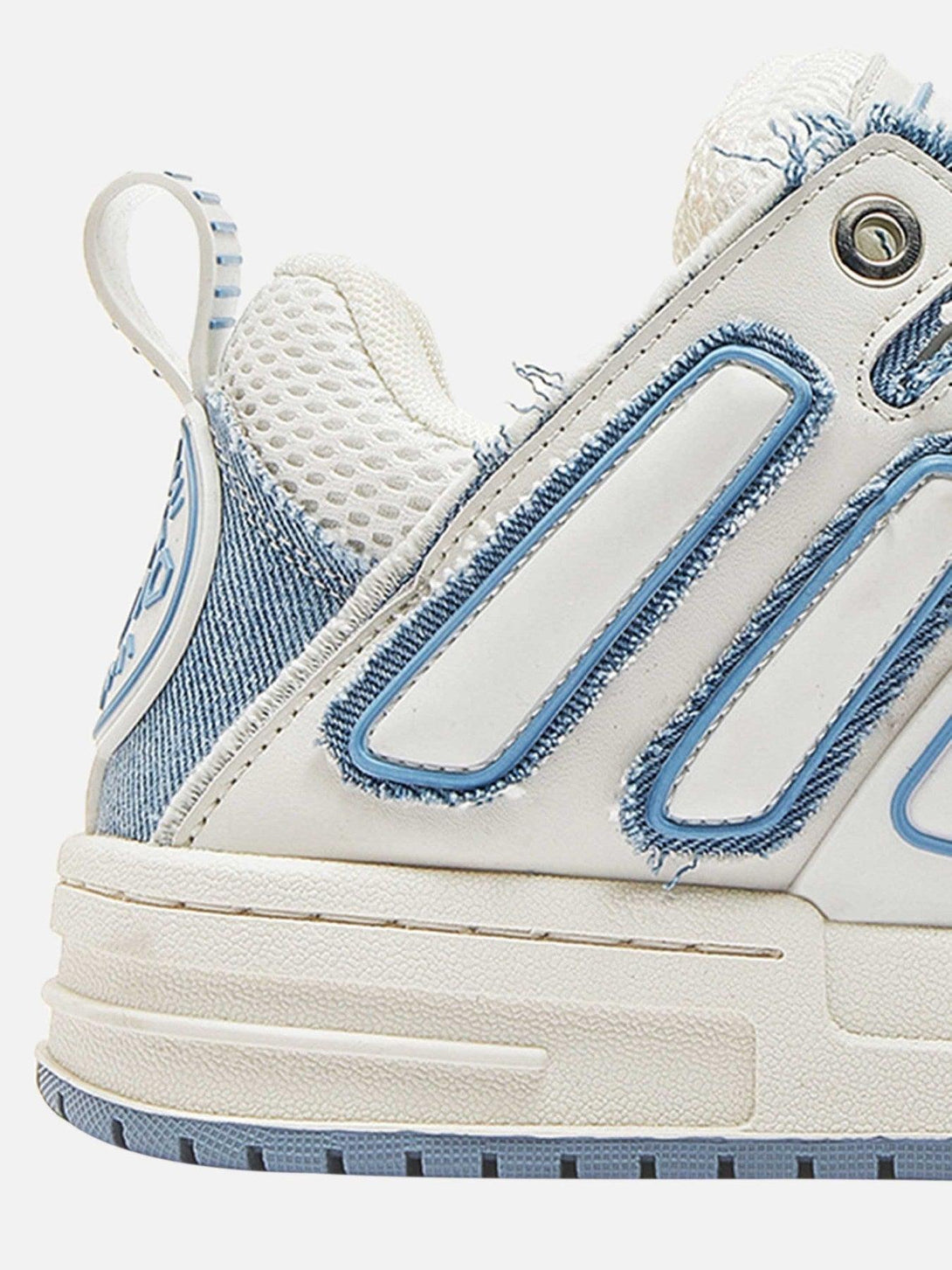 TALISHKO sneakers with denim accents and textured design, highlighting side details.