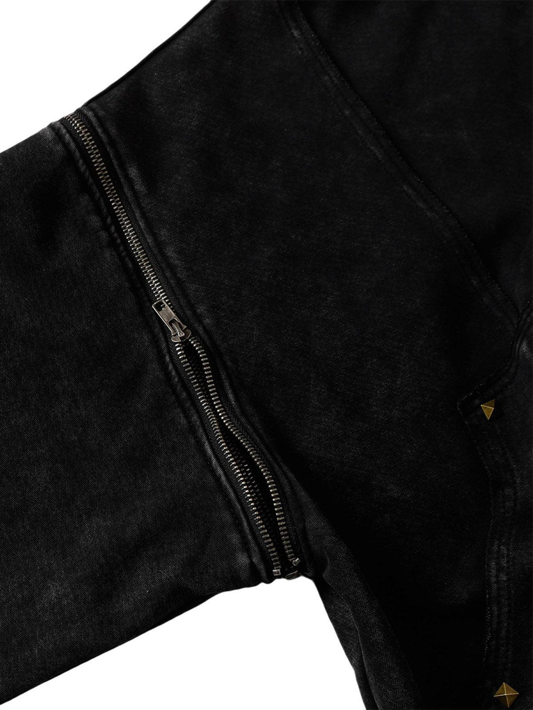 A detailed view of the zipper and texture on a TALISHKO hooded jacket, highlighting its unique design.