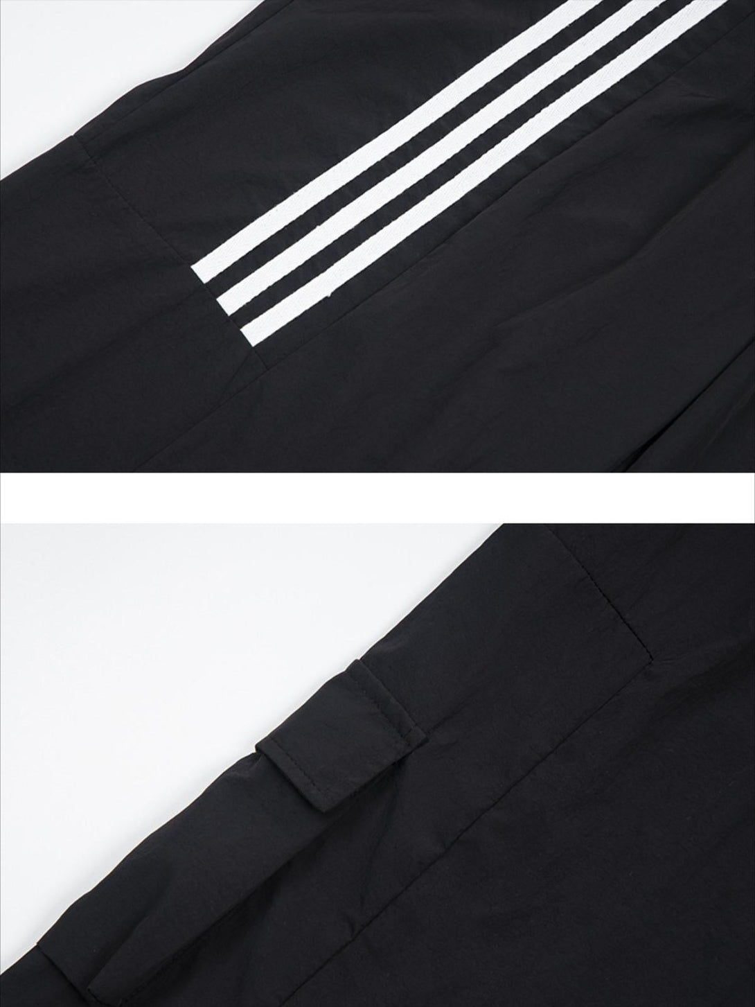 A detailed view of TALISHKO striped draped sweatpants, highlighting white stripes on black fabric.
