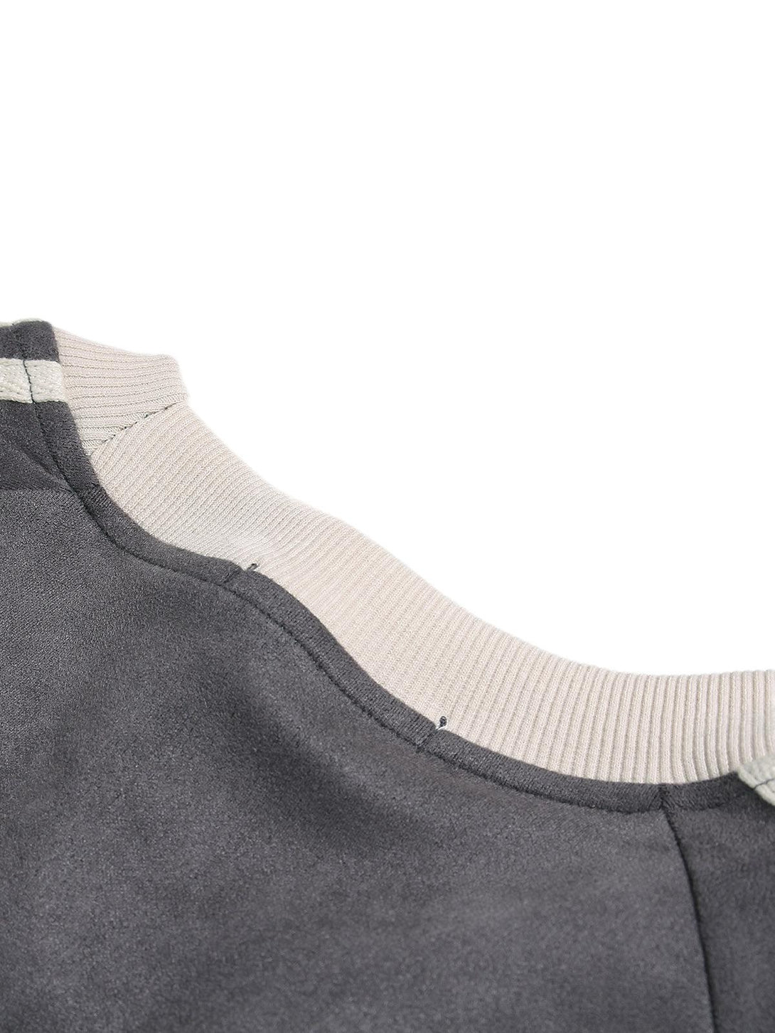 Intricate look at TALISHKO's suede contrast T-shirt, highlighting the ribbed collar detail.
