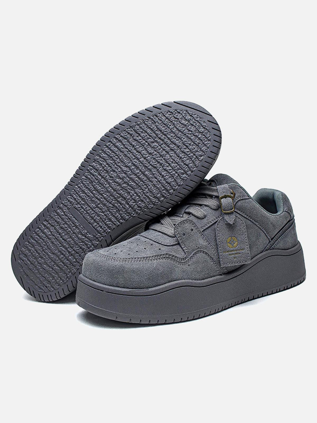 Gray suede low-top skate shoes by TALISHKO with a focus on sole texture and side details.
