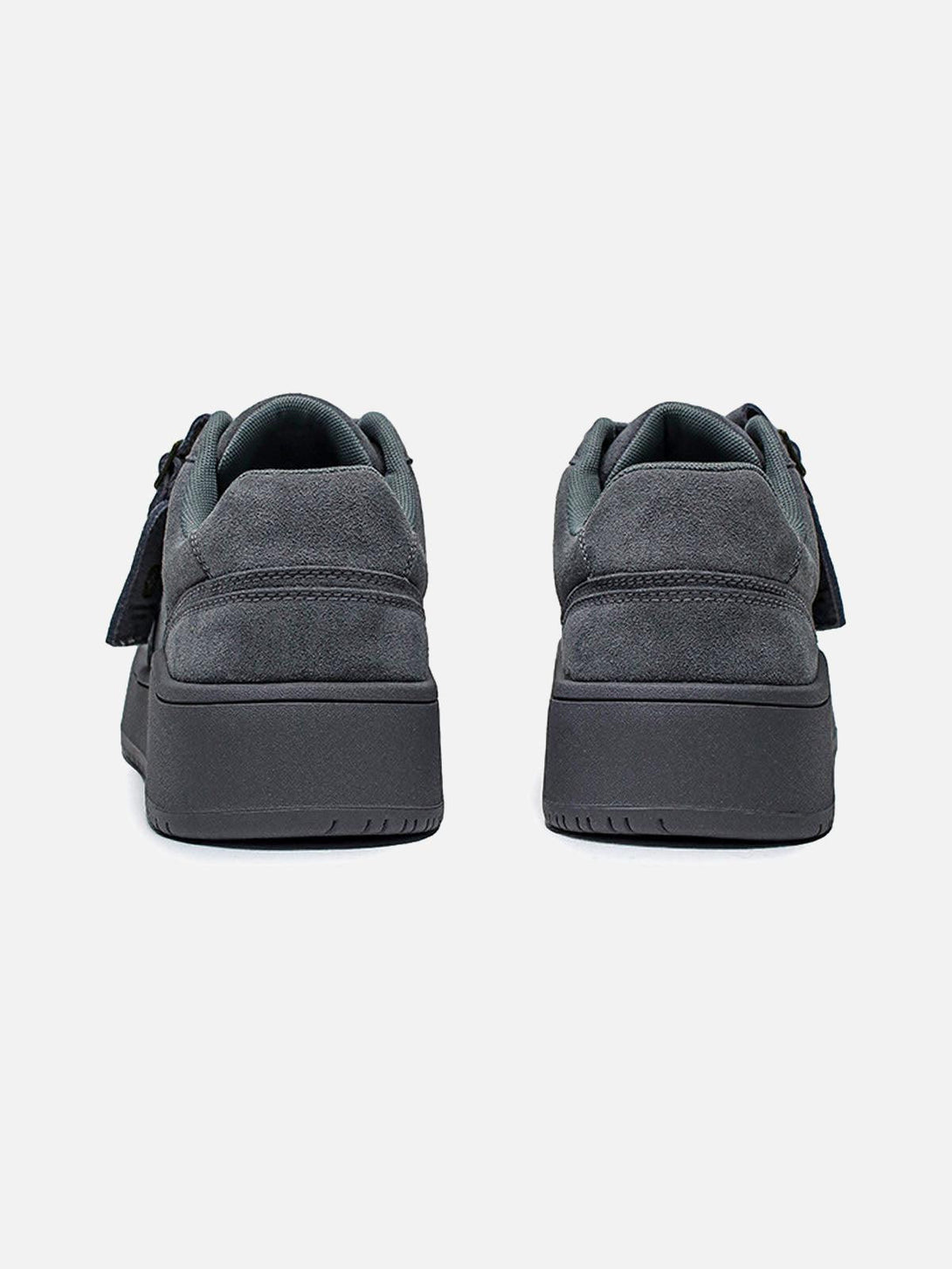 Back view of TALISHKO's gray suede low-top skate shoes, showcasing sleek design and structure.
