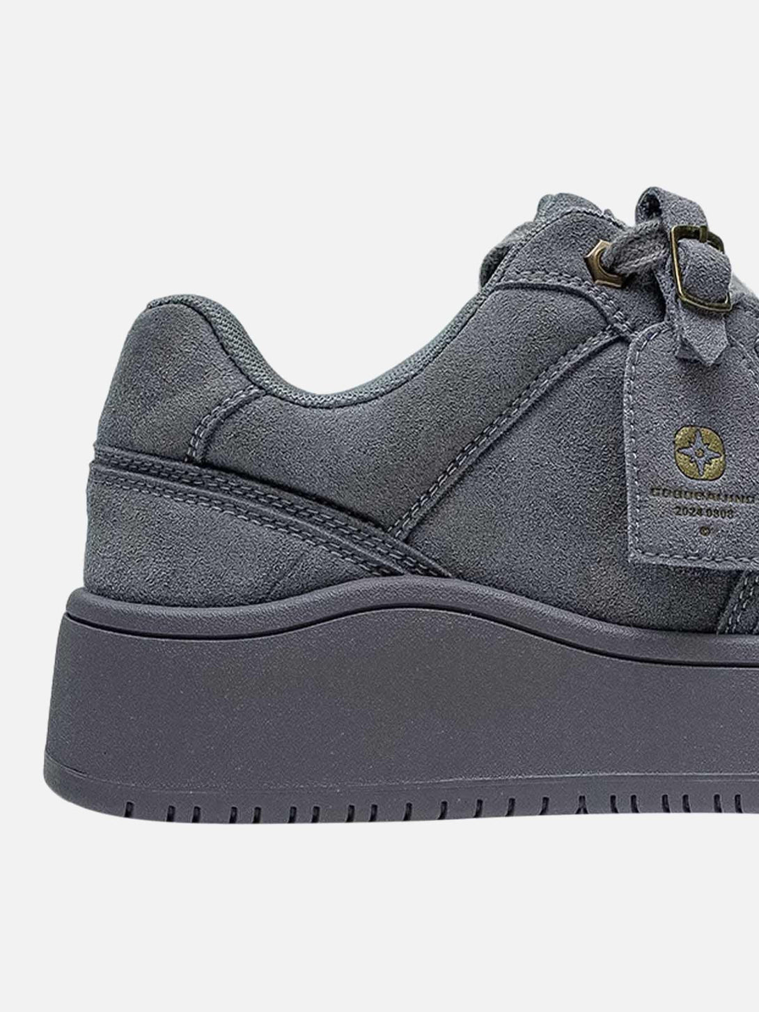 Detailed view of TALISHKO's suede skate shoes, focusing on the side and sole design.