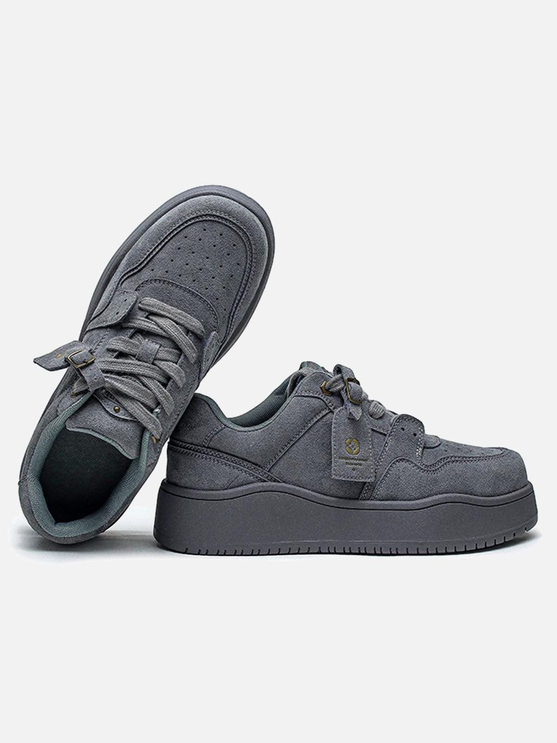 Gray suede low-top skate shoes by TALISHKO, featuring a side view with detailed stitching.