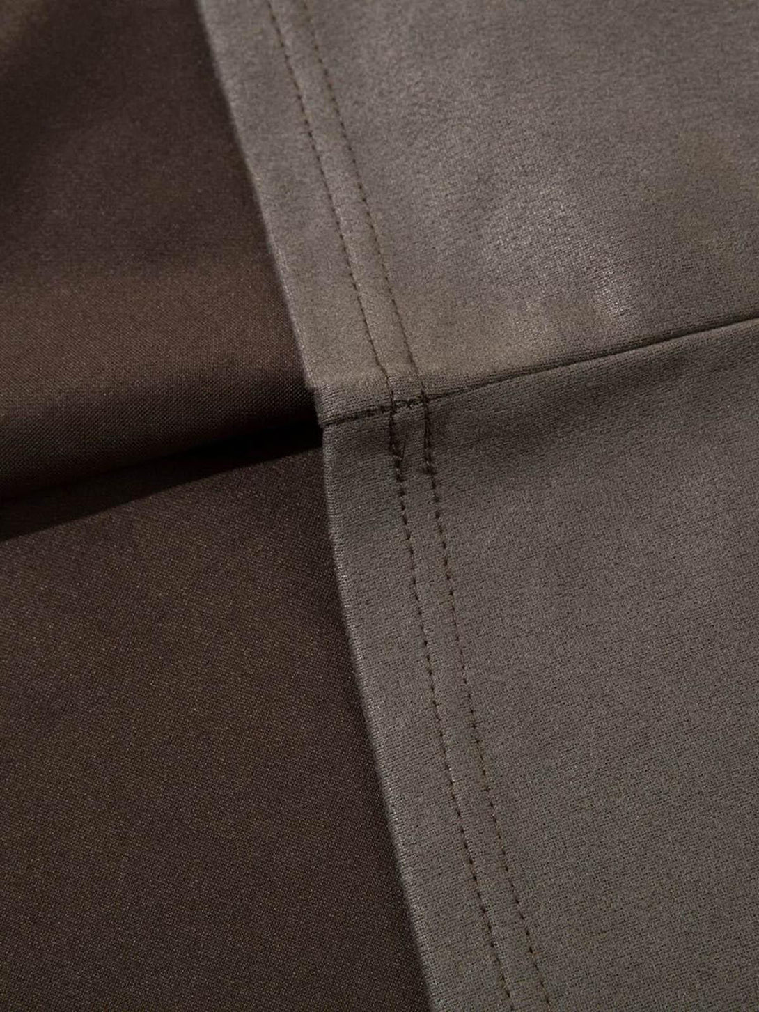 Detailed stitching and texture of a suede vest by TALISHKO, emphasizing craftsmanship.